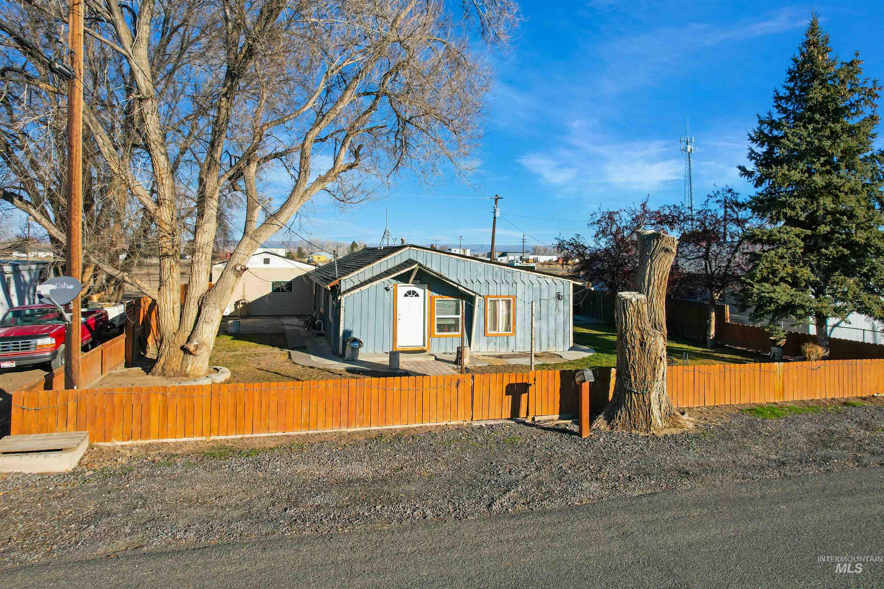 Bungalow-style home with a fenced front yard