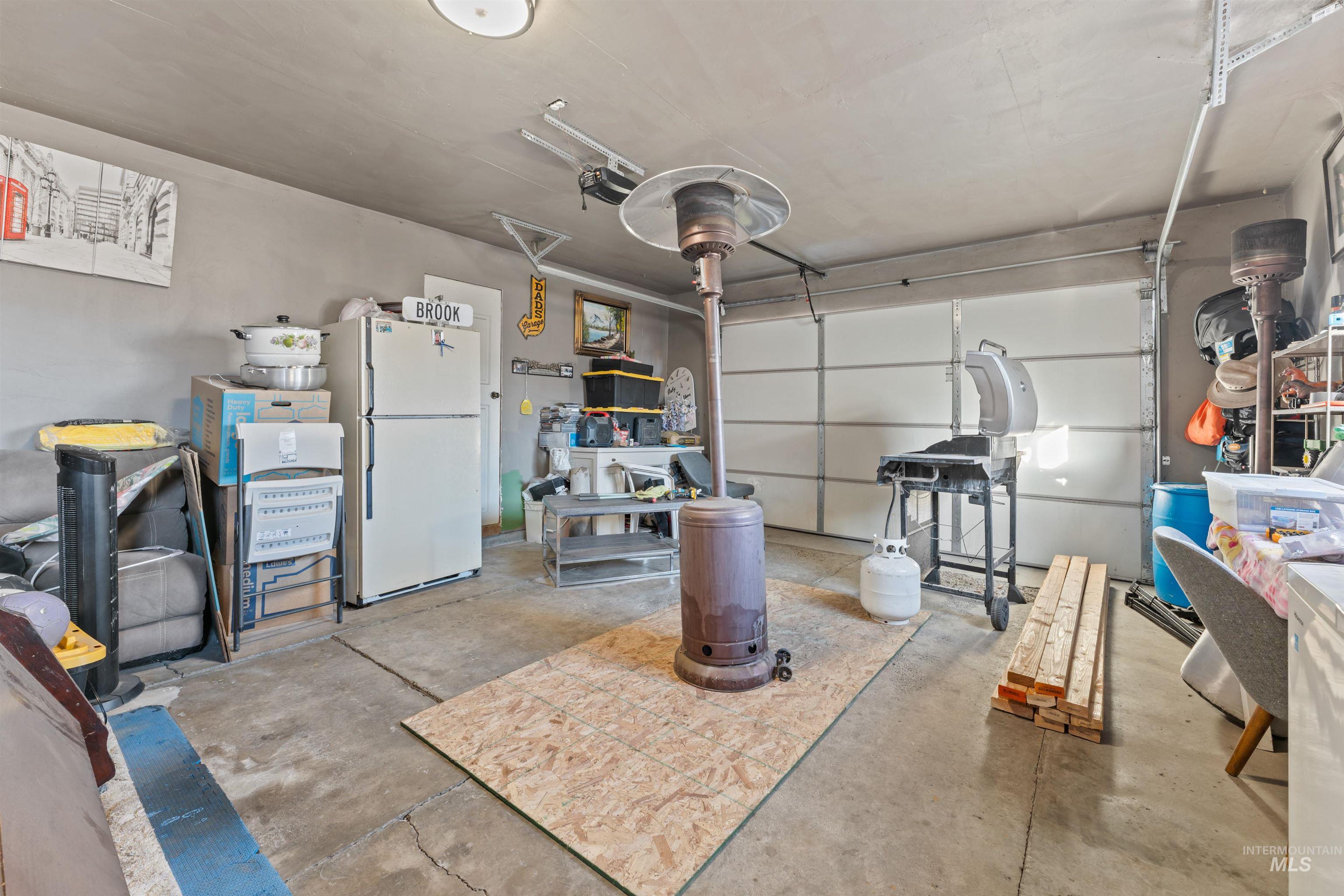 Garage with freestanding refrigerator