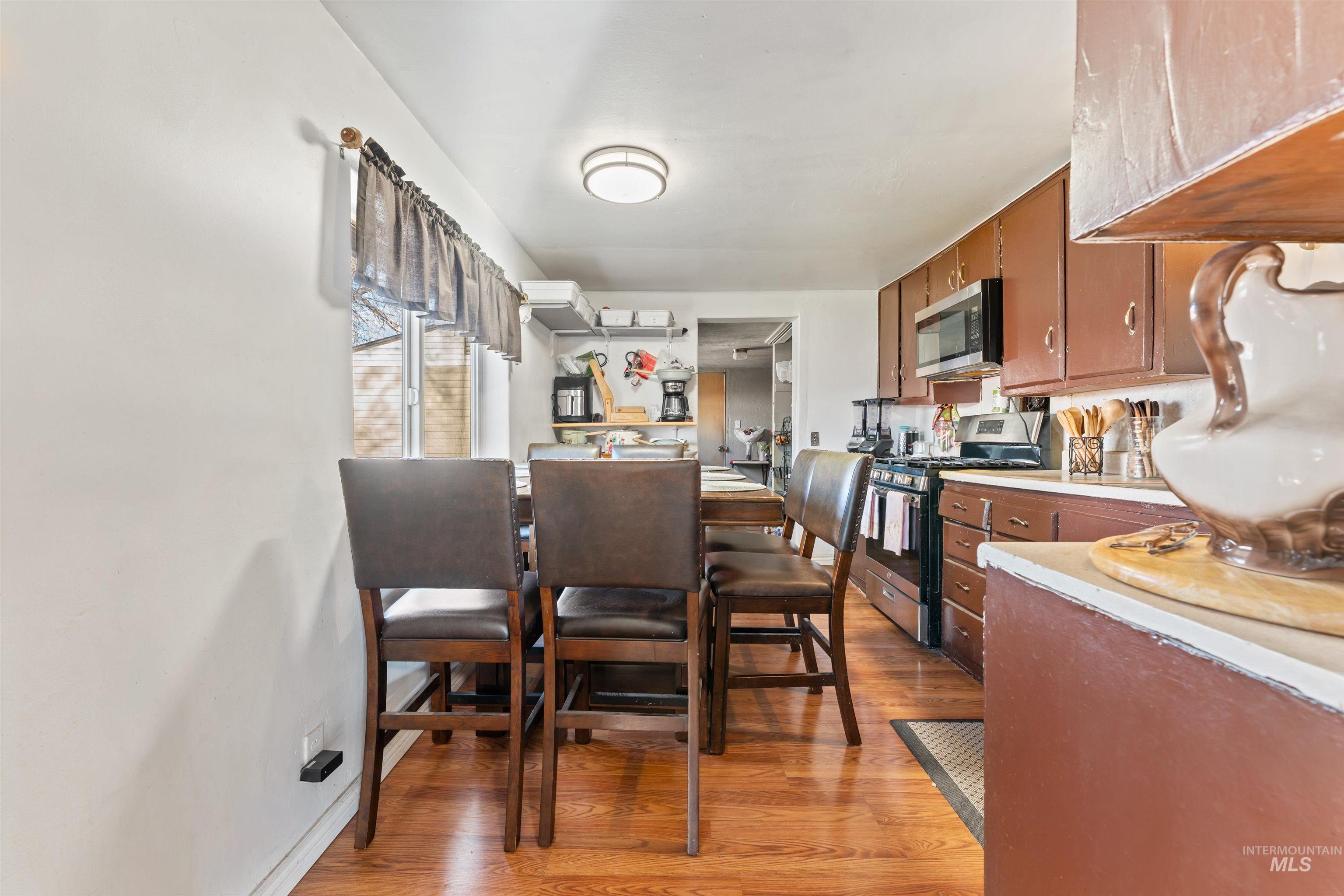 Dining area featuring light wood-style floors