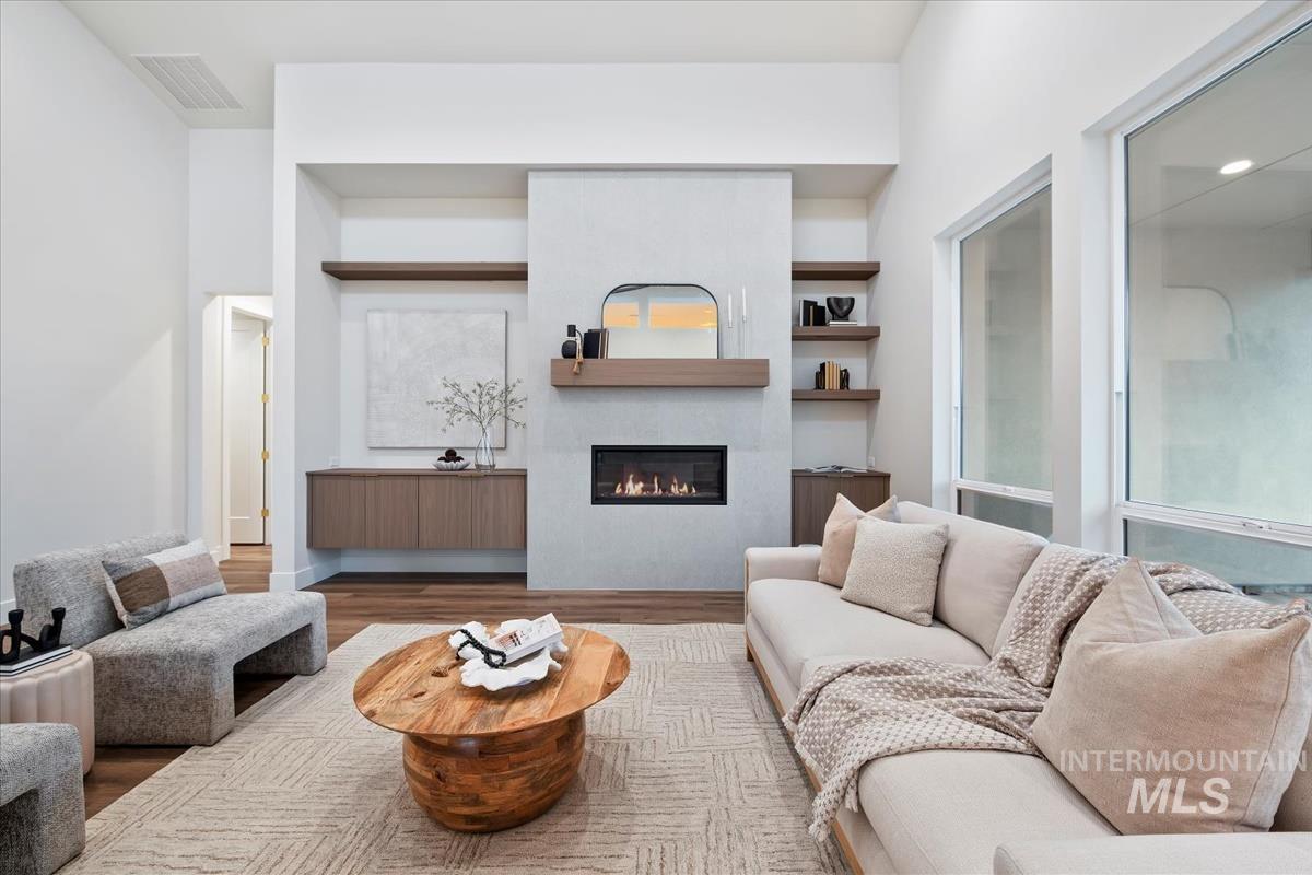 Living area with wood finished floors and a fireplace