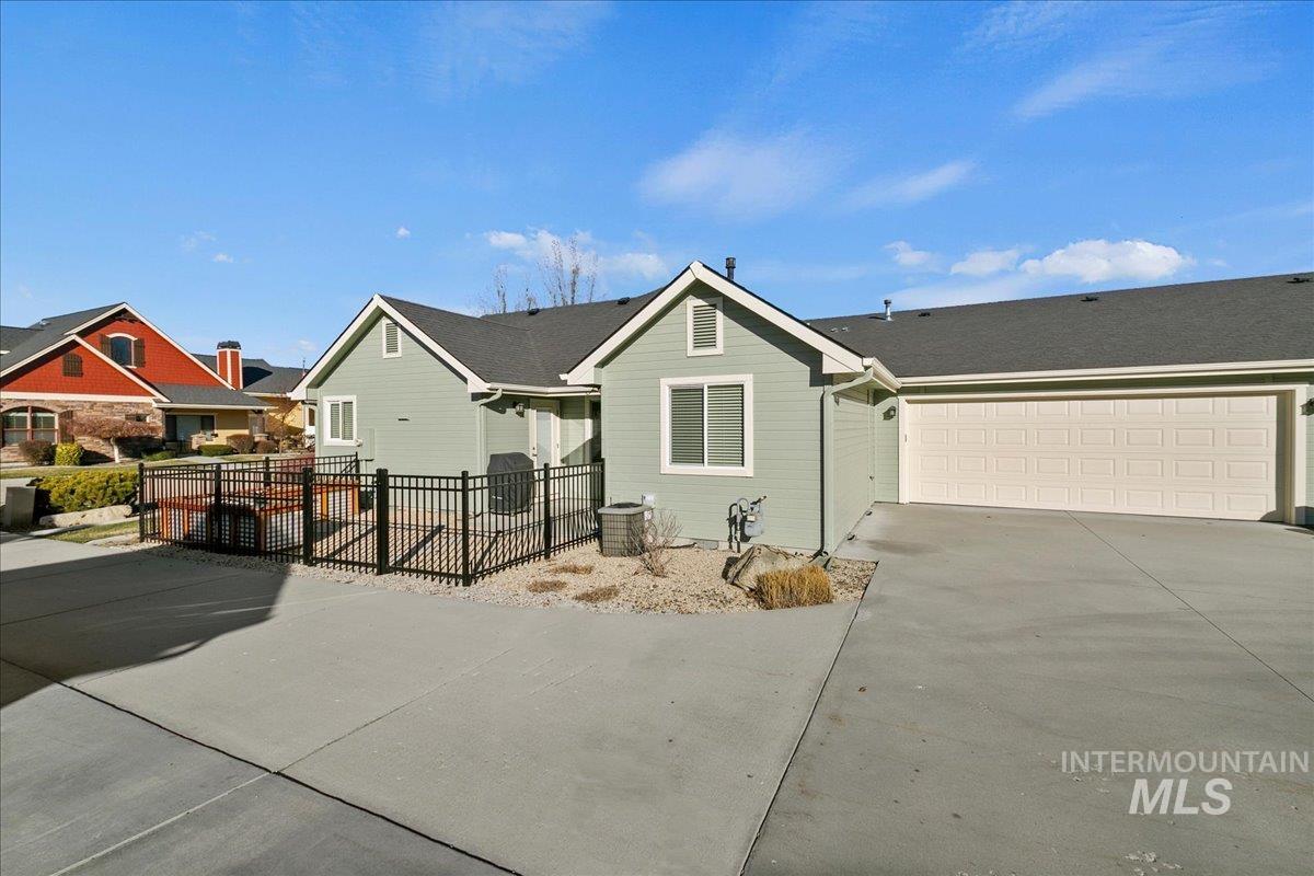Single story home featuring driveway and a garage