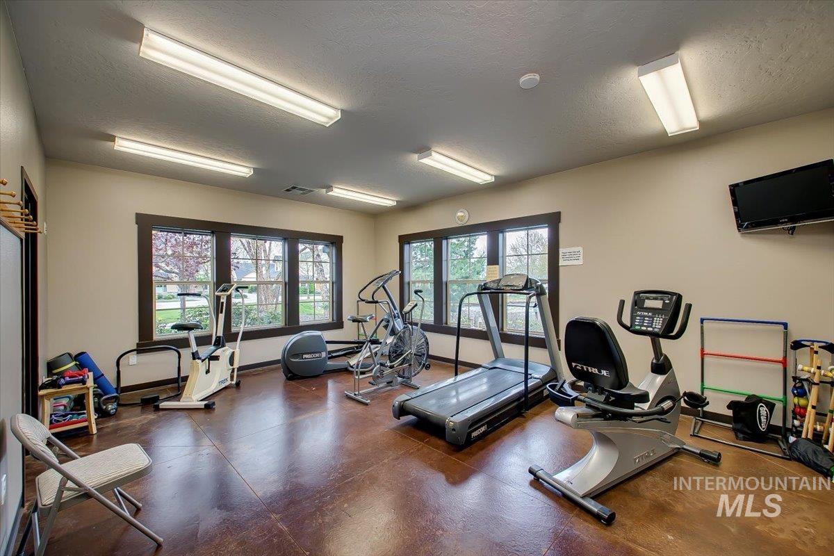 Workout area with a textured ceiling