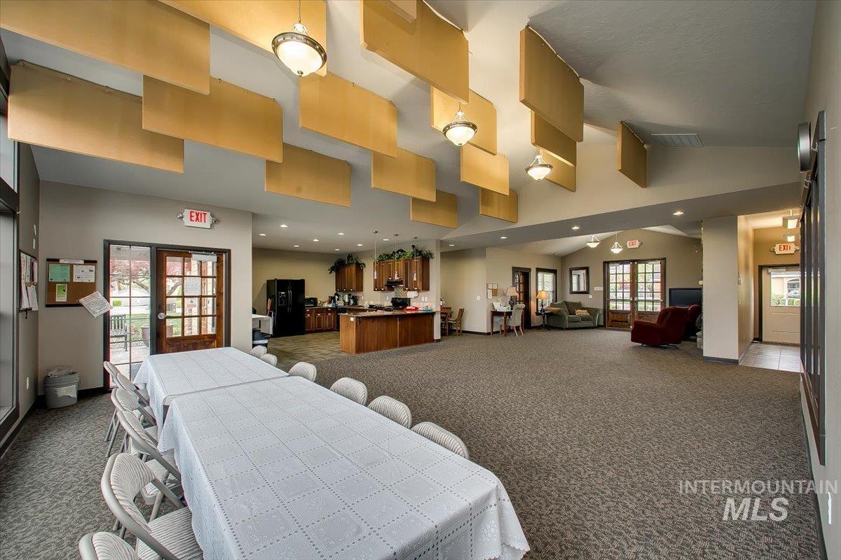 Building lobby with vaulted ceiling and recessed lighting