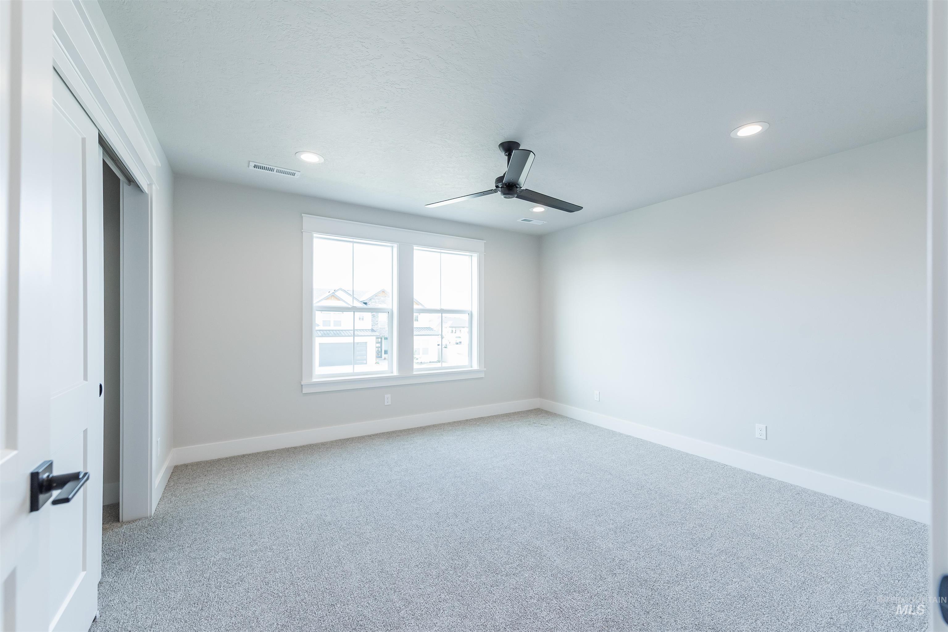 Unfurnished bedroom with a ceiling fan, light carpet, a closet, and recessed lighting