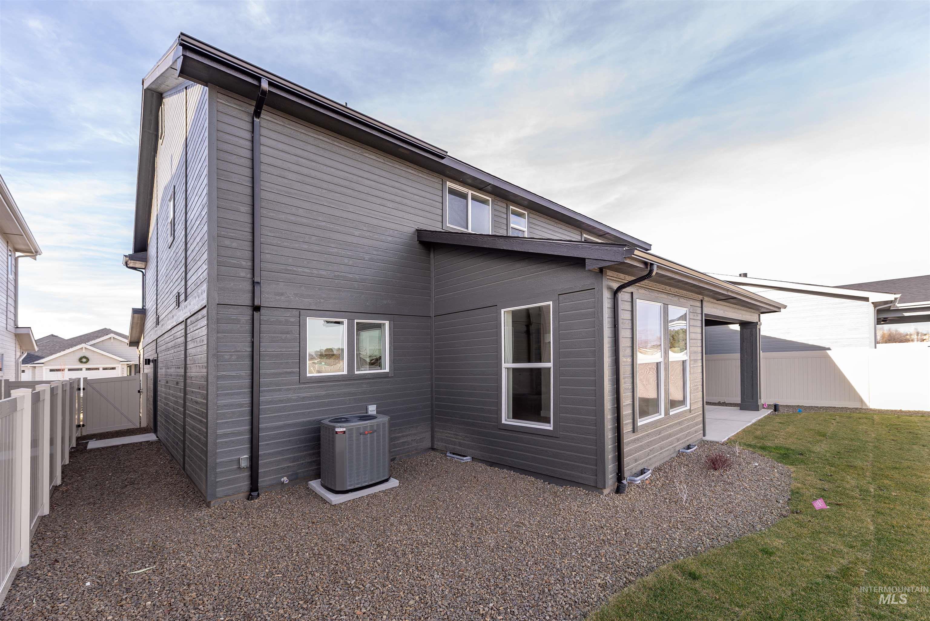 Back of property featuring a fenced backyard