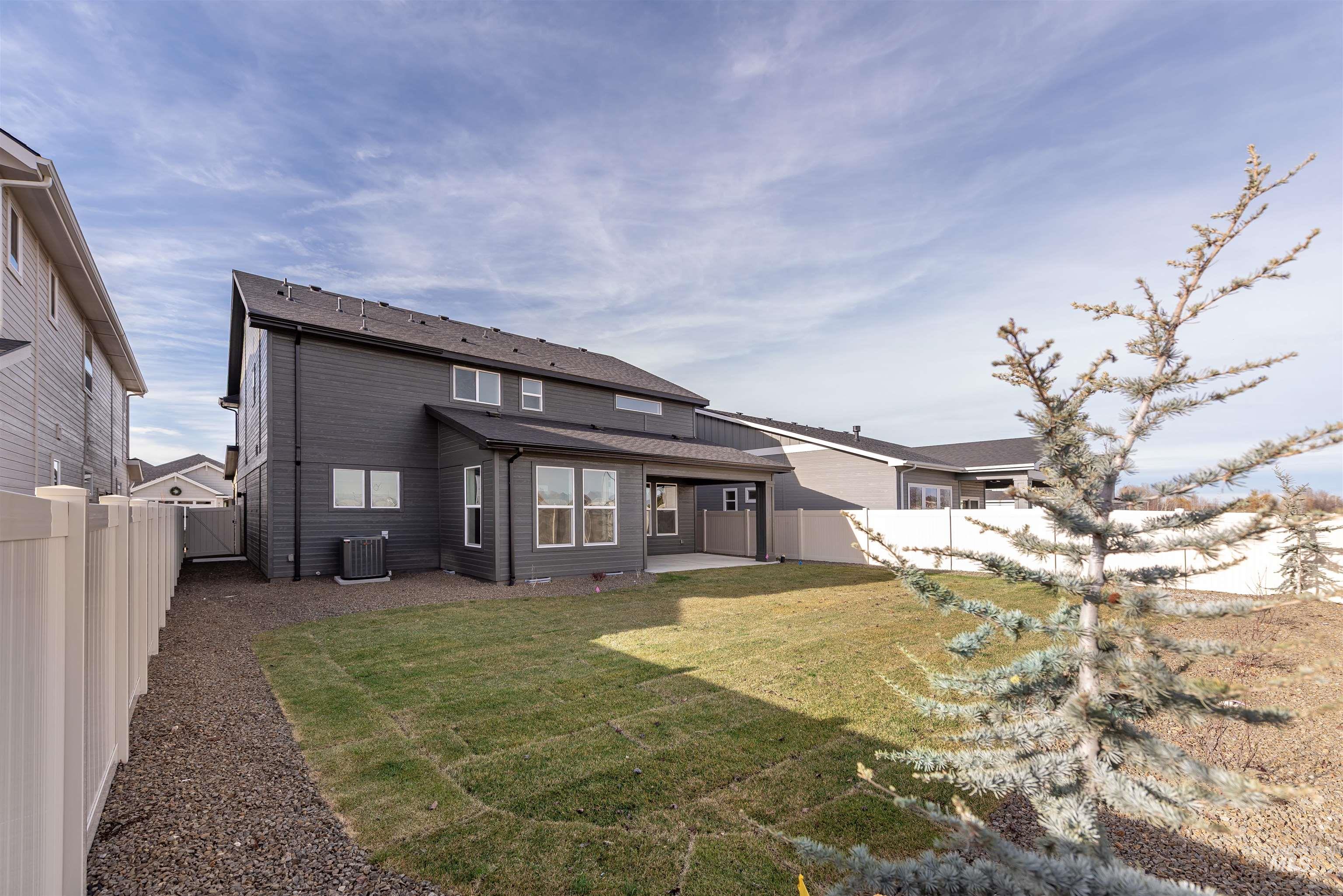 Back of property featuring a patio area and a fenced backyard