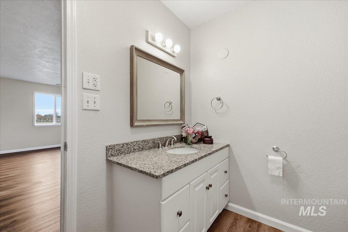 Primary Bathroom. single vanity with granite counter