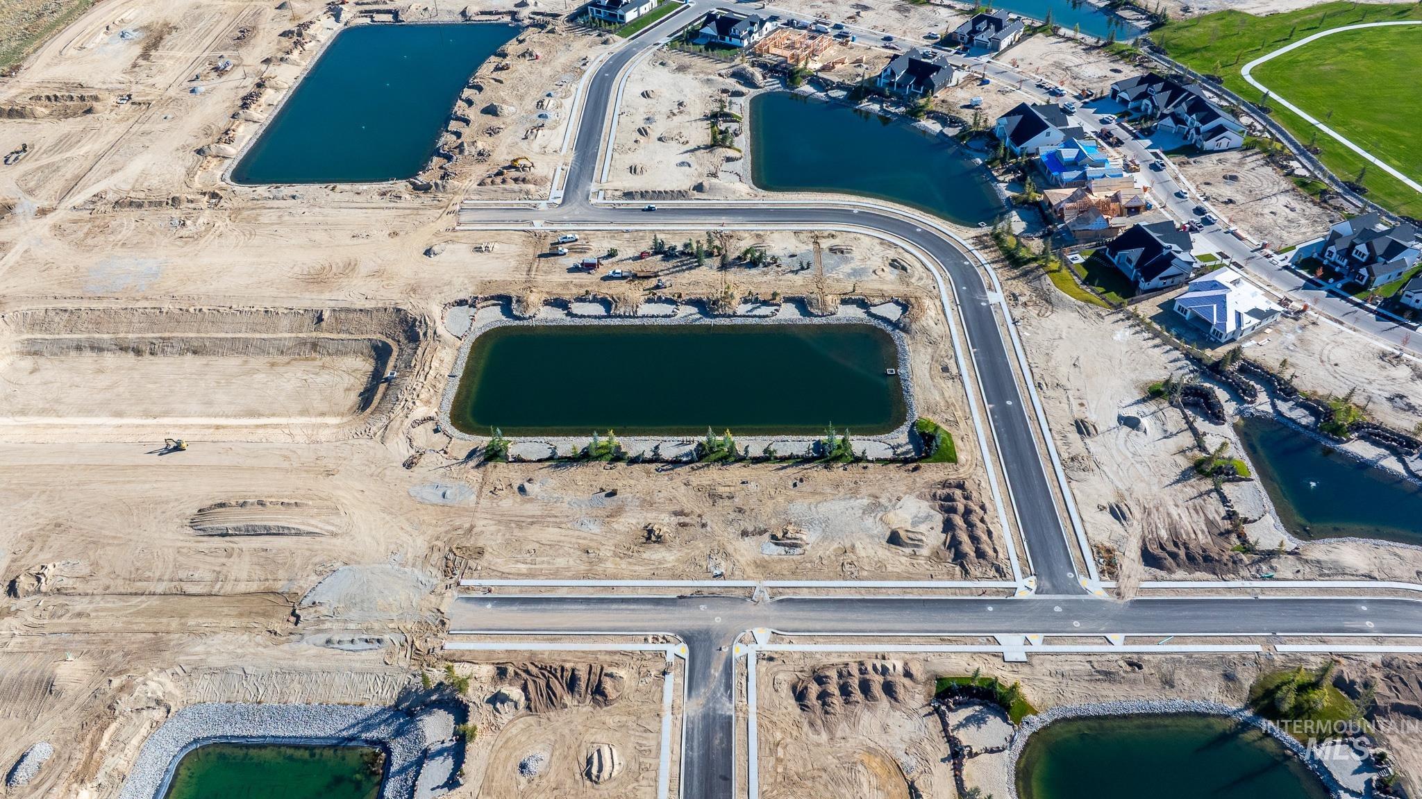 Aerial view of property and surrounding area with a large body of water