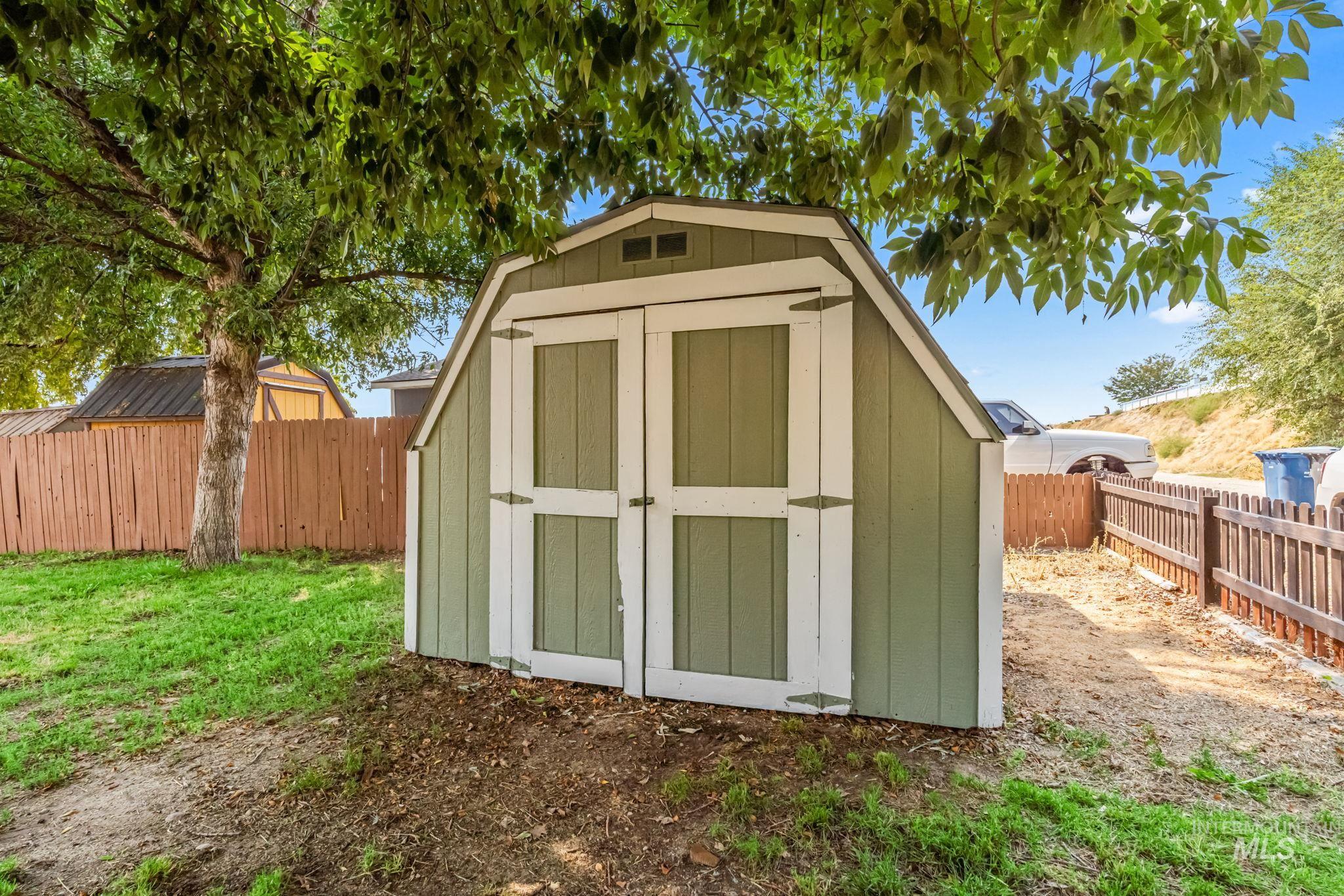 View of shed featuring a fenced backyard