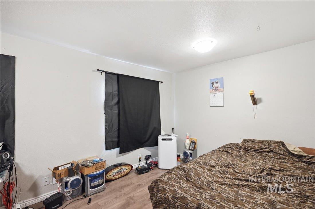 Bedroom with wood finished floors