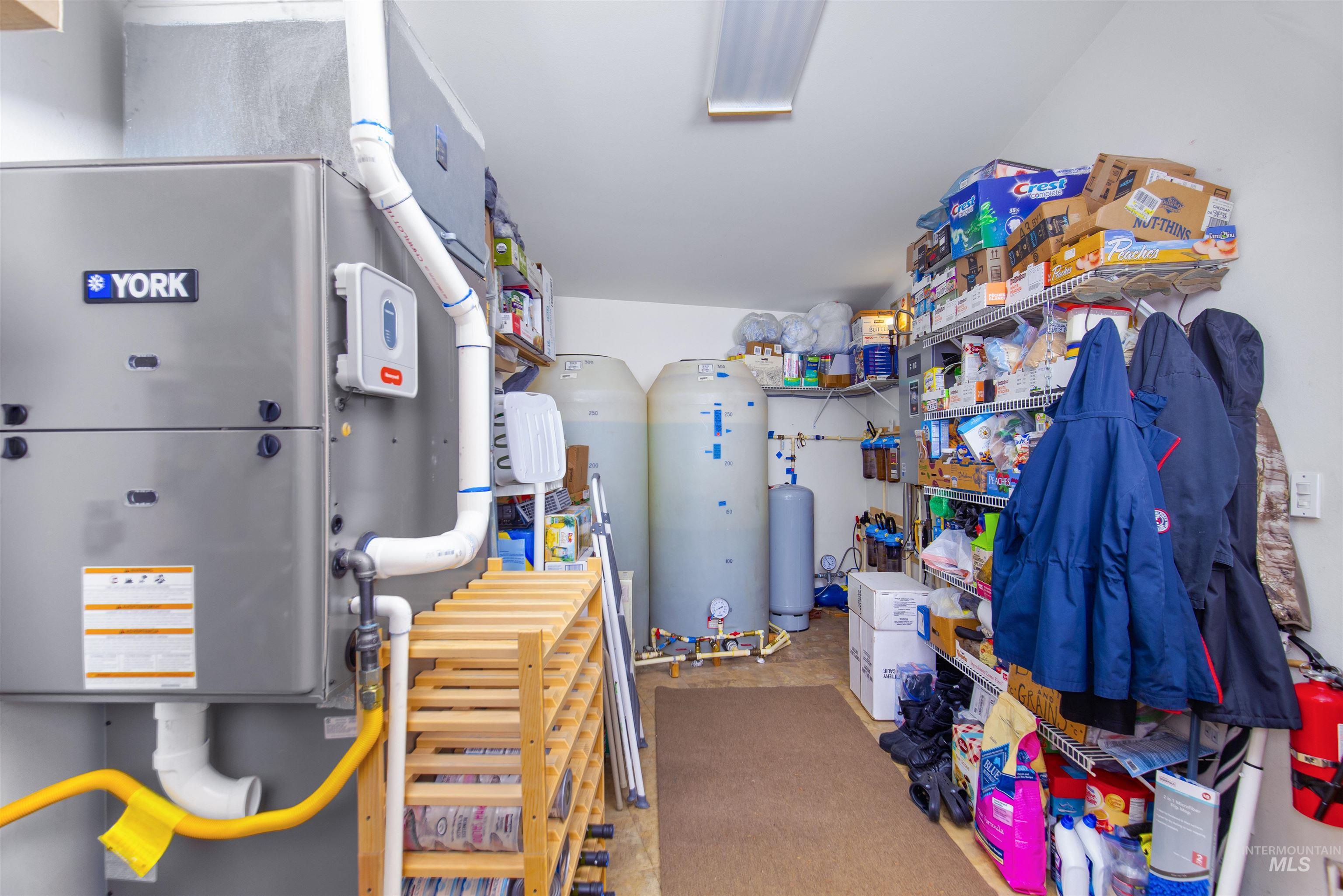 Walk-in Utility/Pantry room with direct garage access.