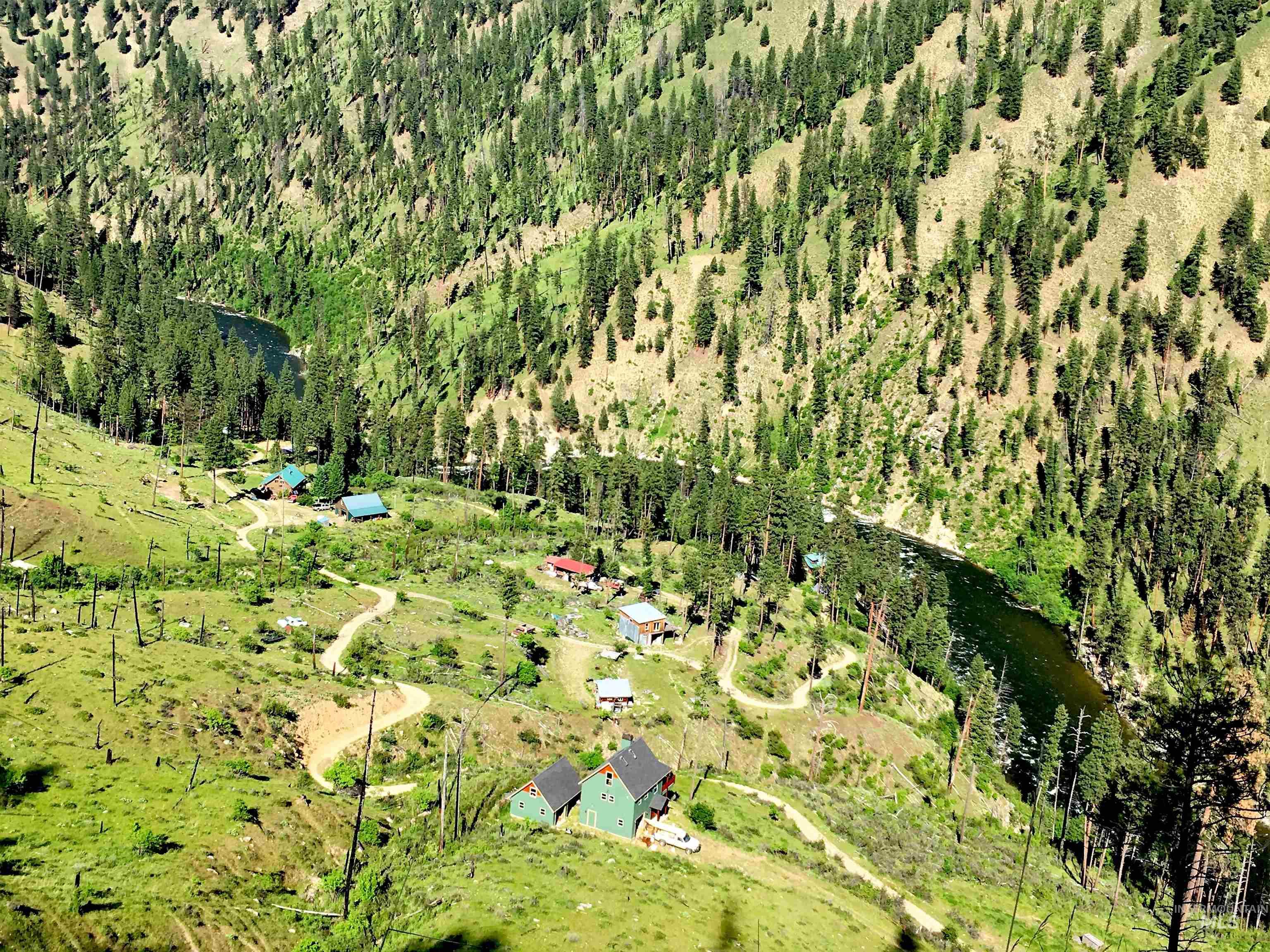 Aerial overview of property's location with rural landscape and a large body of water
