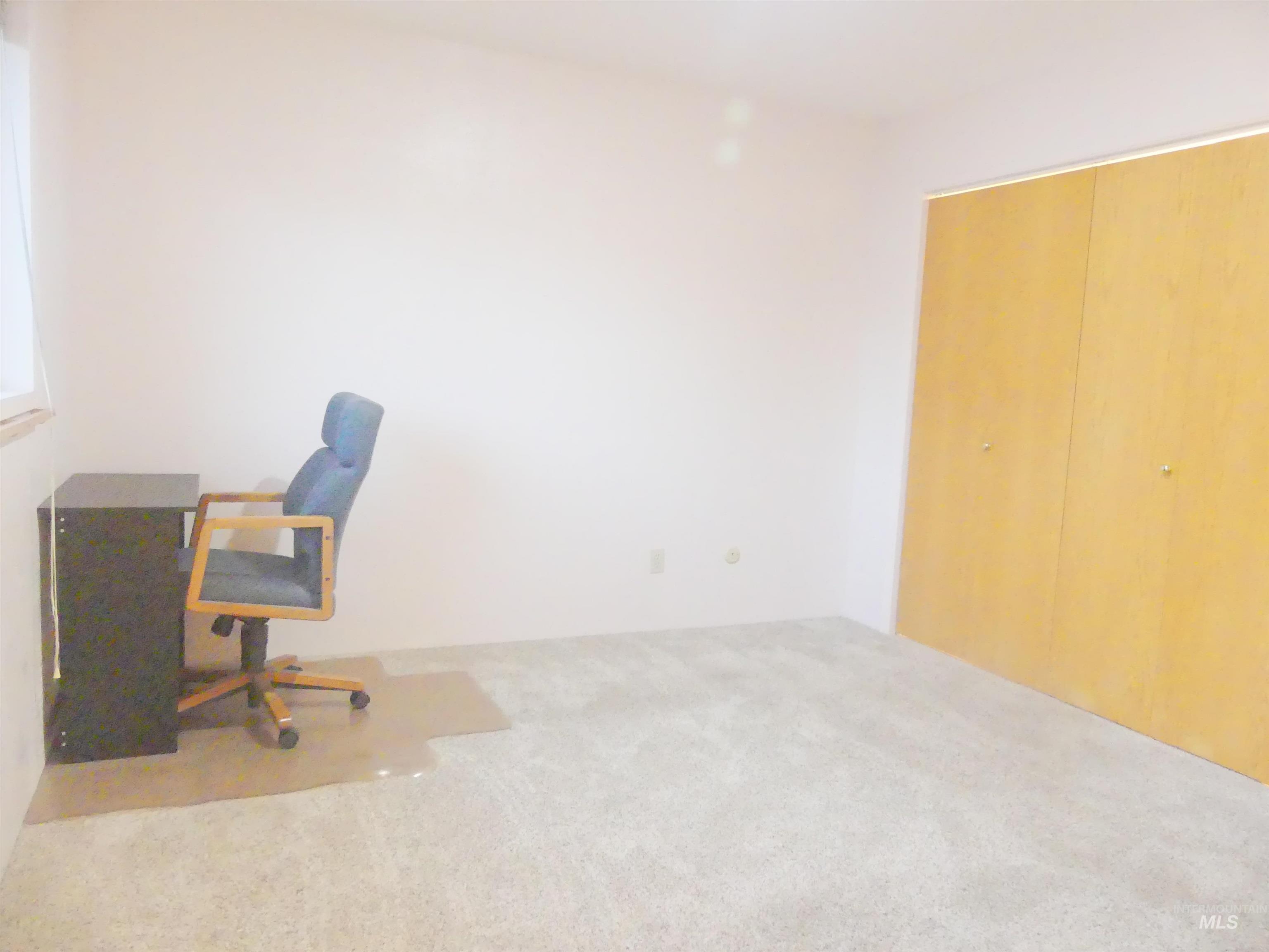 Office space featuring carpet flooring