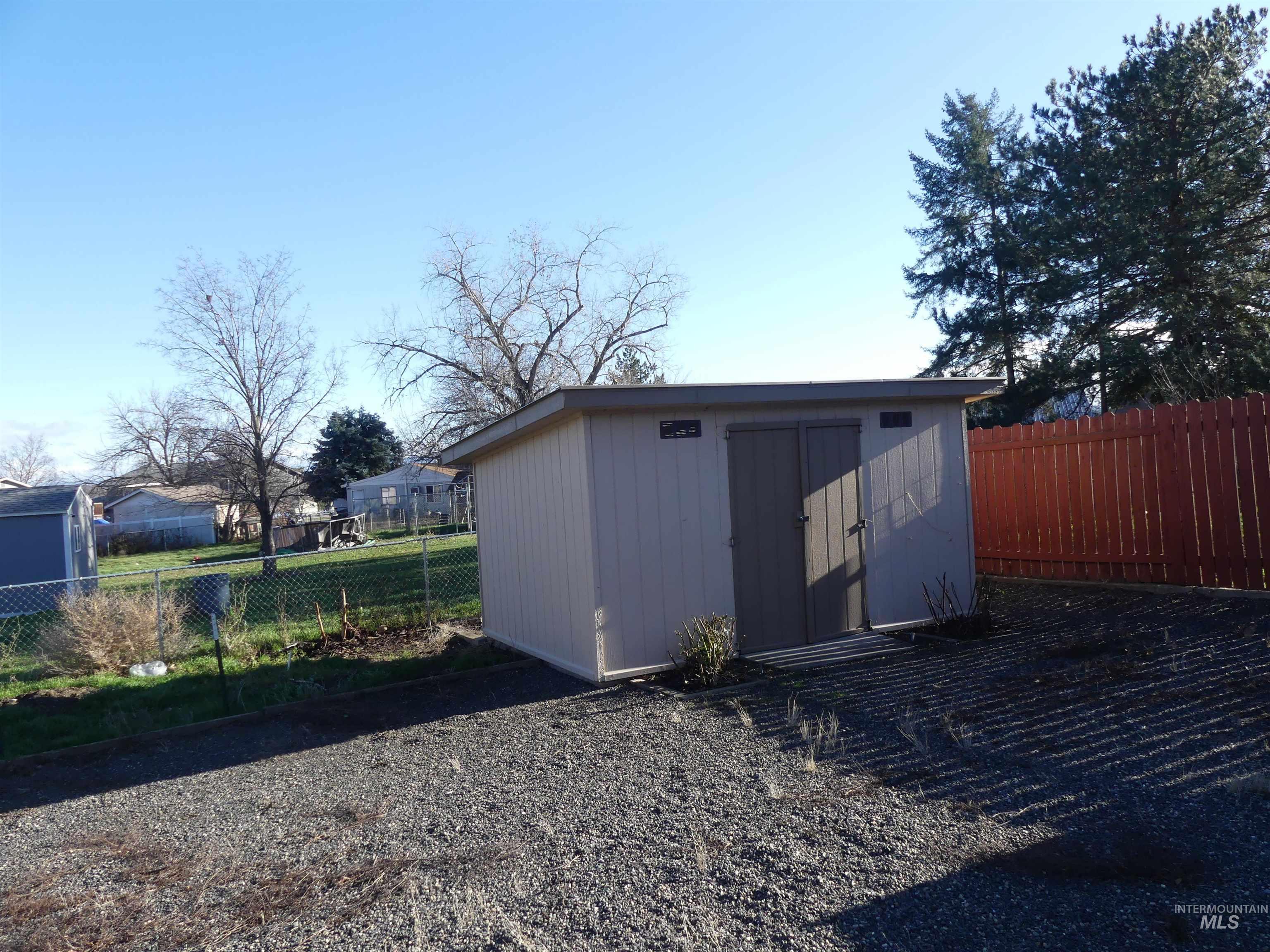 View of shed featuring a fenced backyard