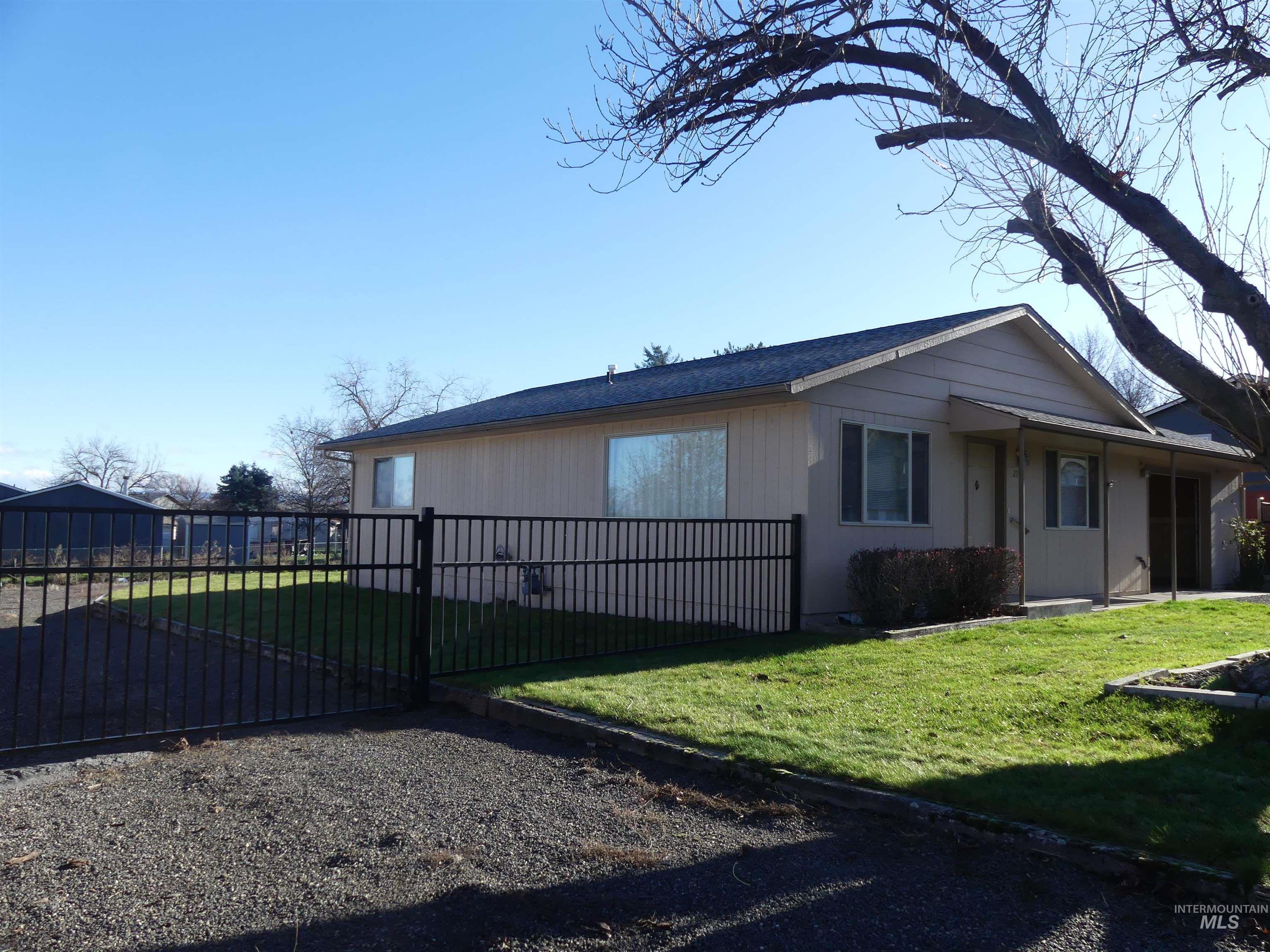 View of home's exterior with a gate