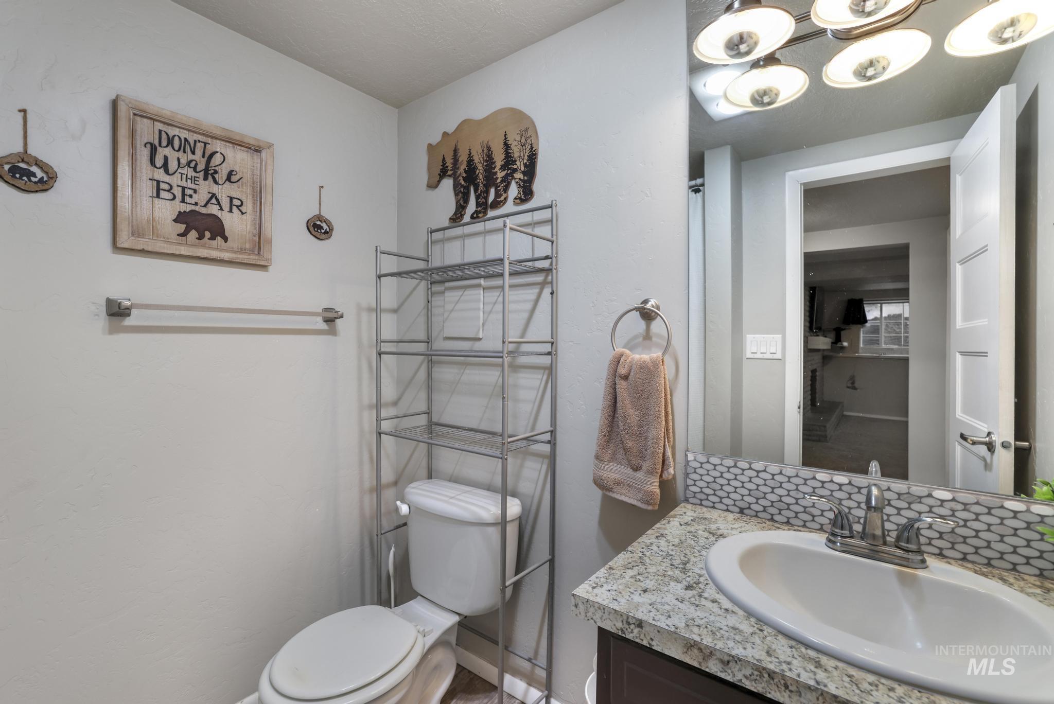 Bathroom with vanity and a chandelier