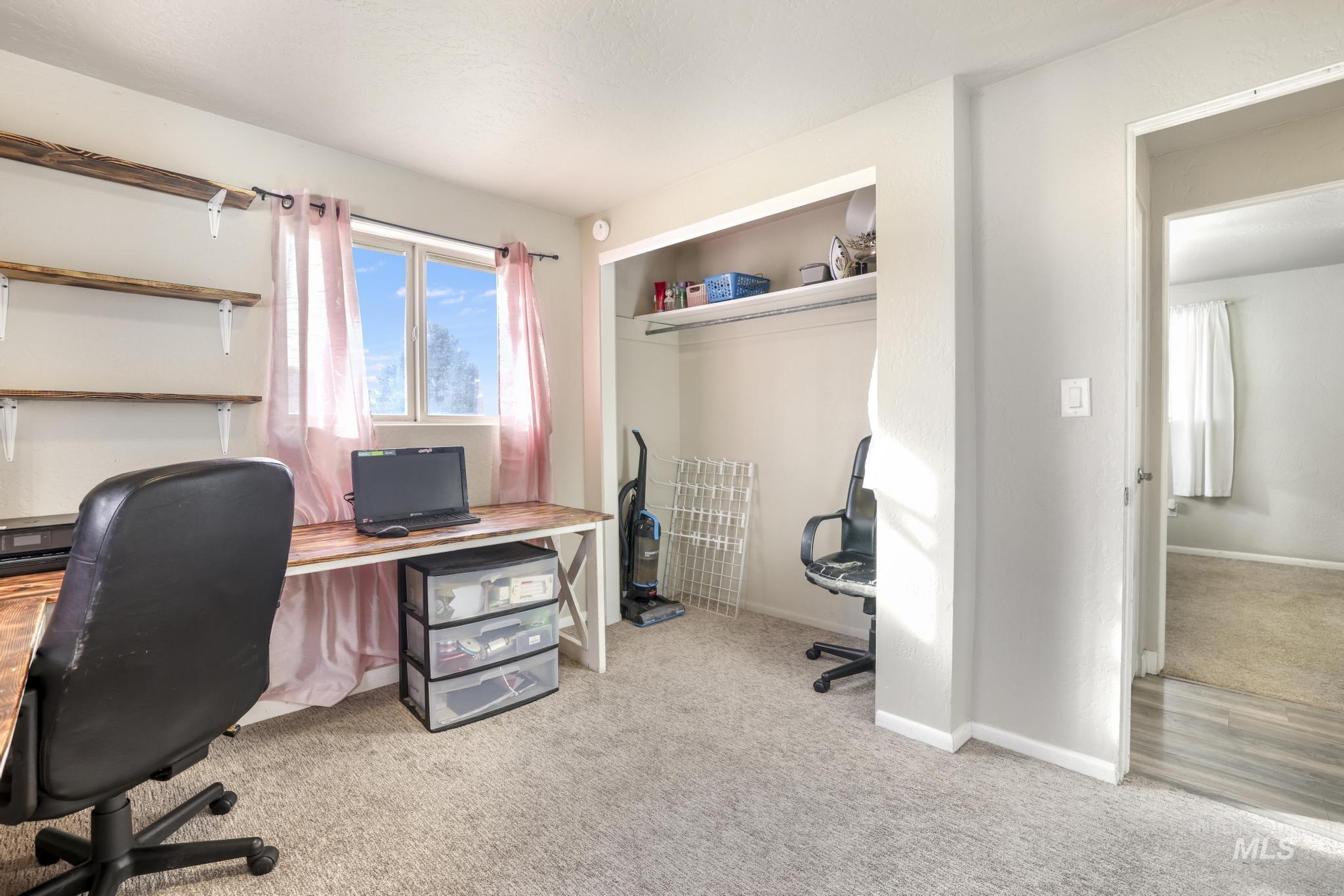 Office space featuring light carpet