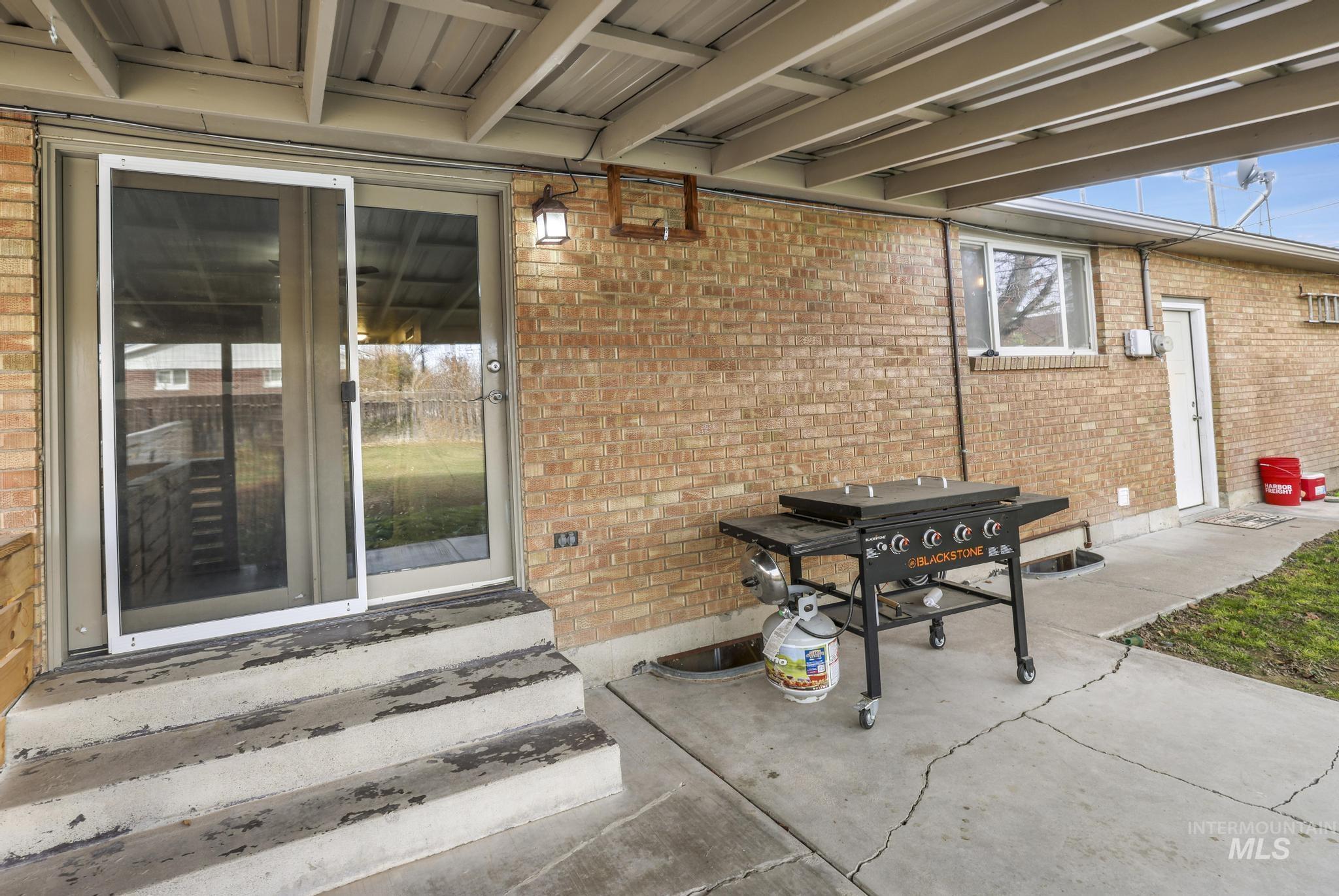 View of patio / terrace featuring entry steps and area for grilling