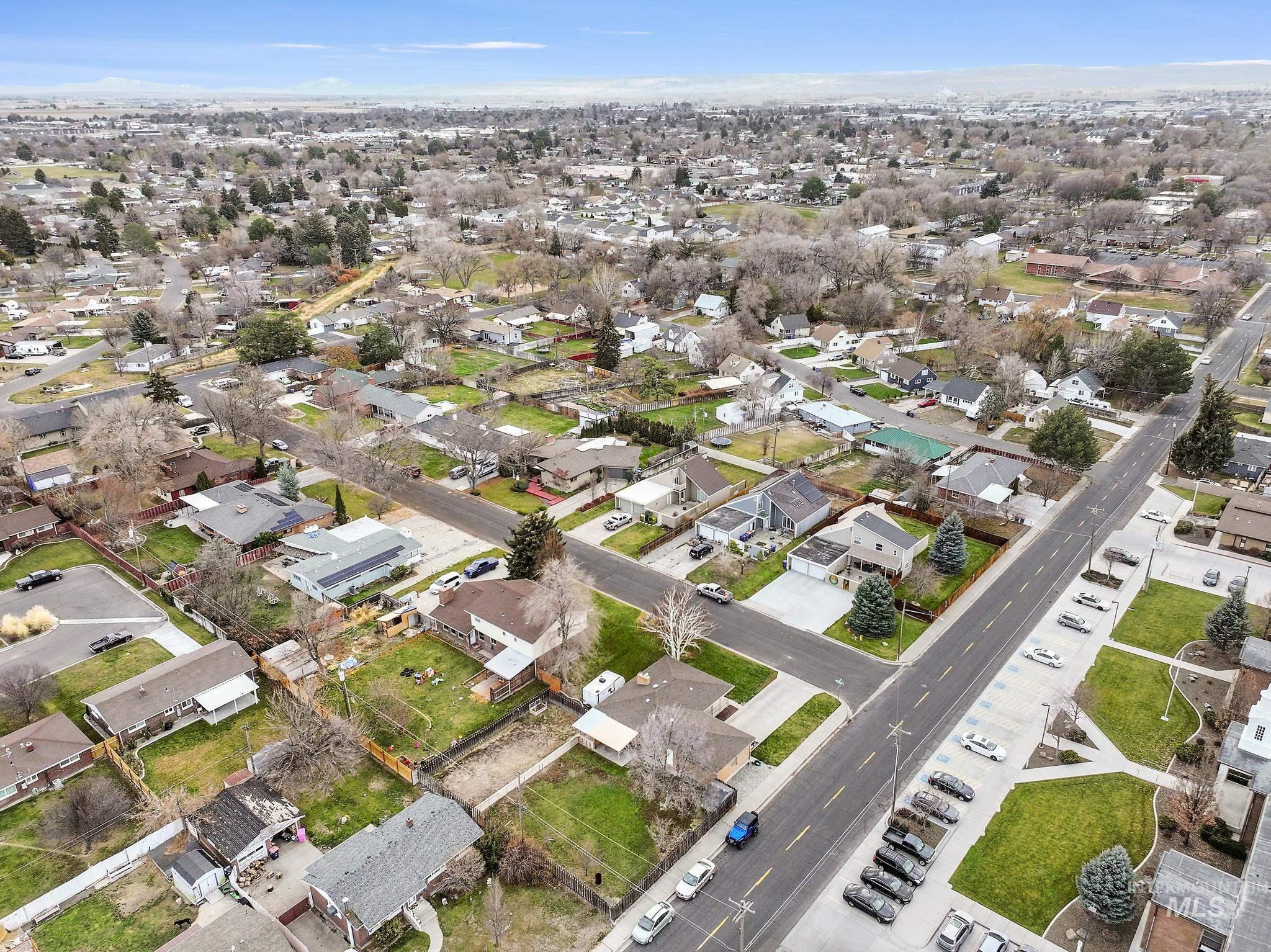 Aerial overview of property's location with nearby suburban area