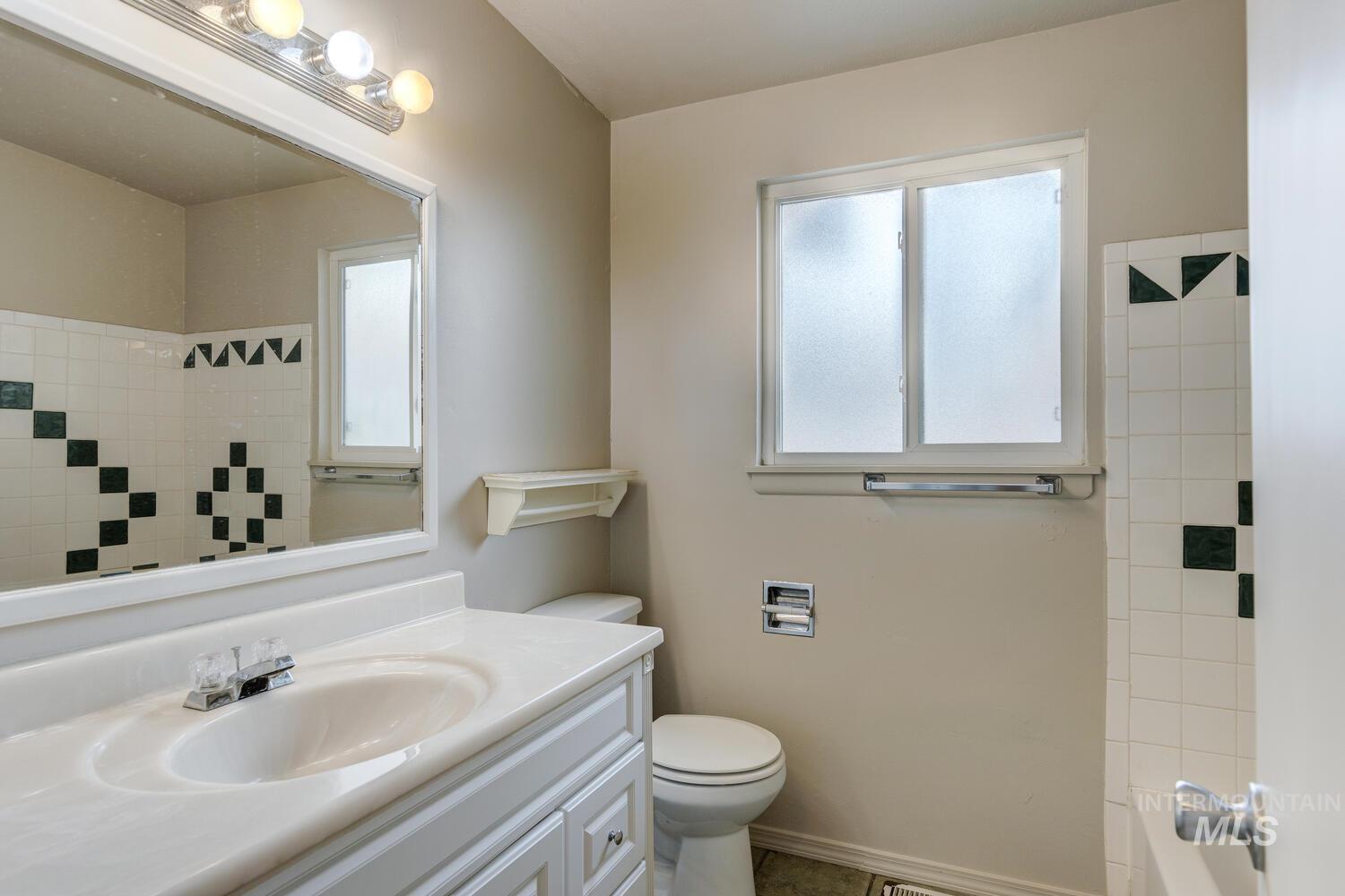Bathroom with vanity and toilet
