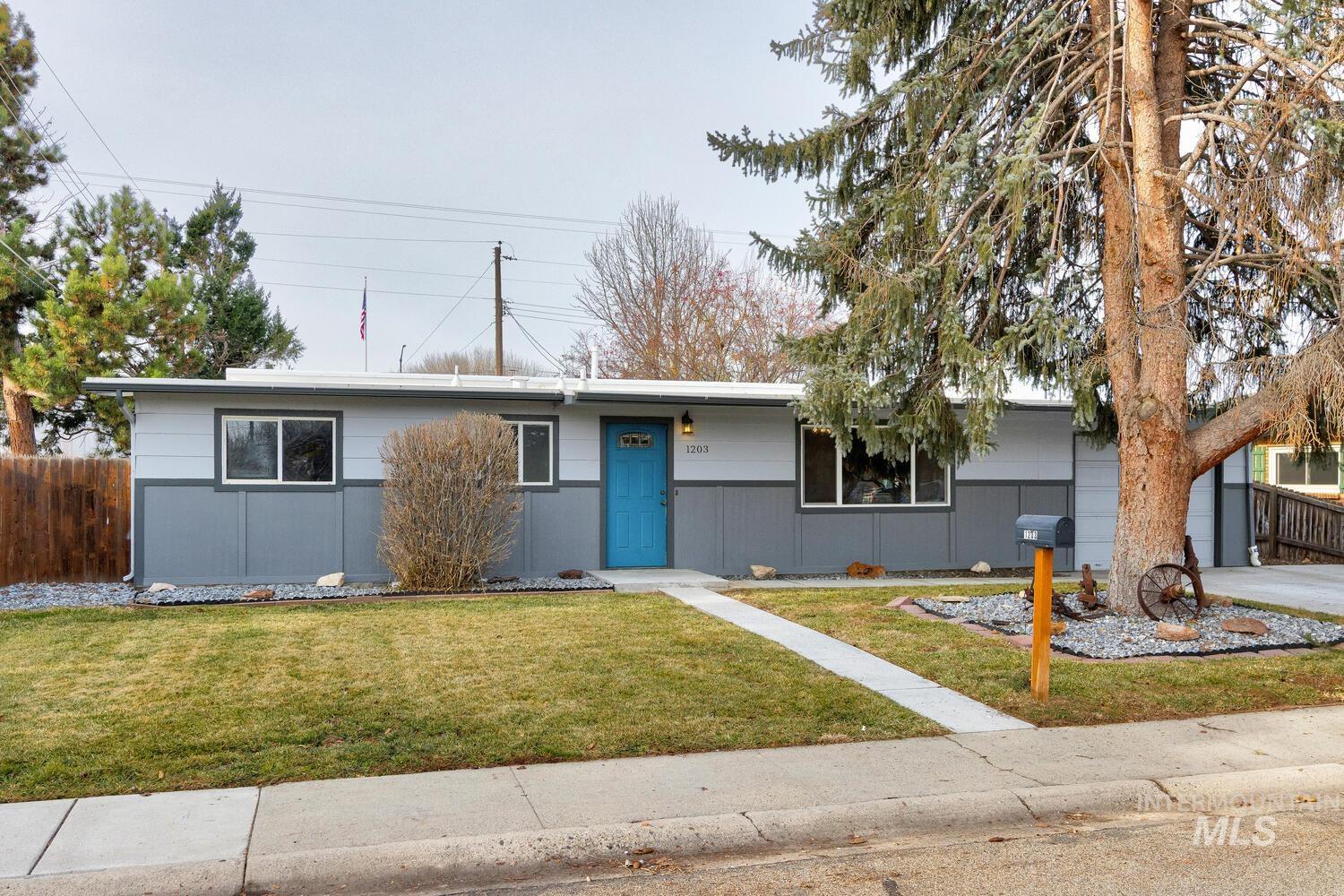 Single story home featuring an attached garage