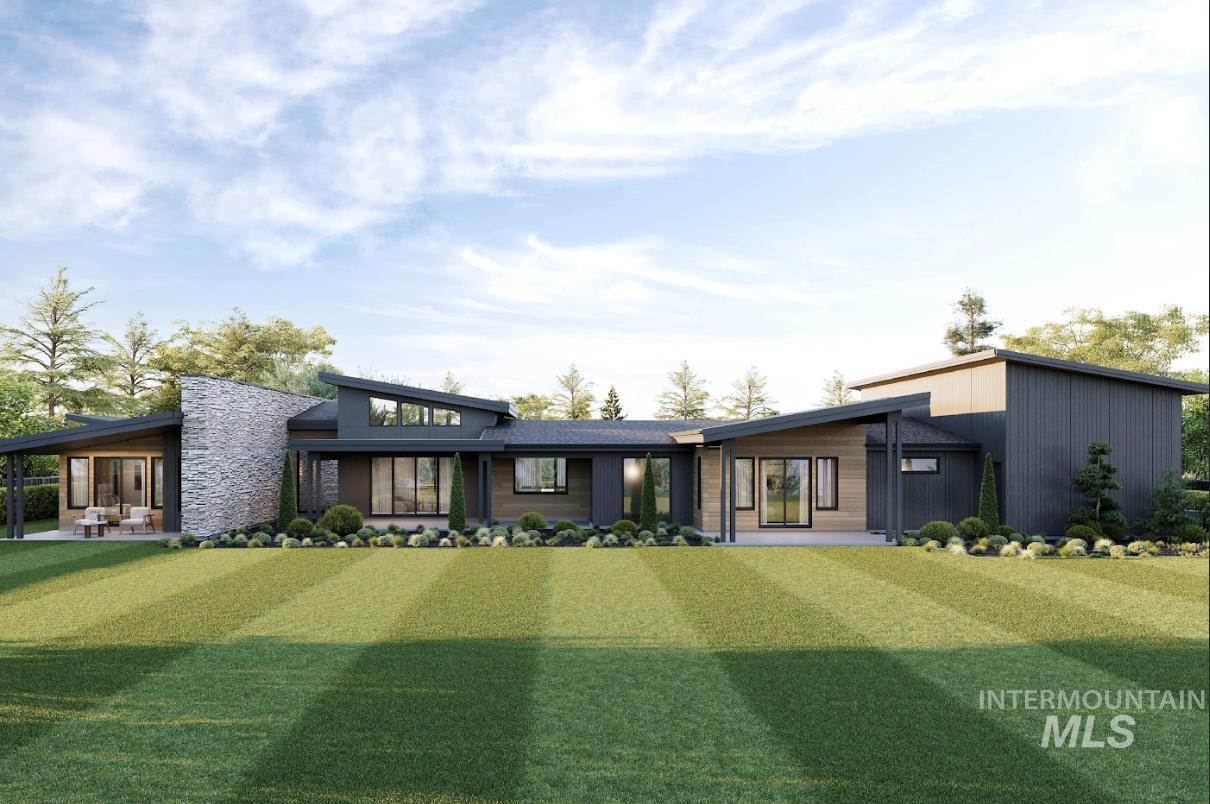 View of front of property featuring stone siding, a patio area, and a front yard