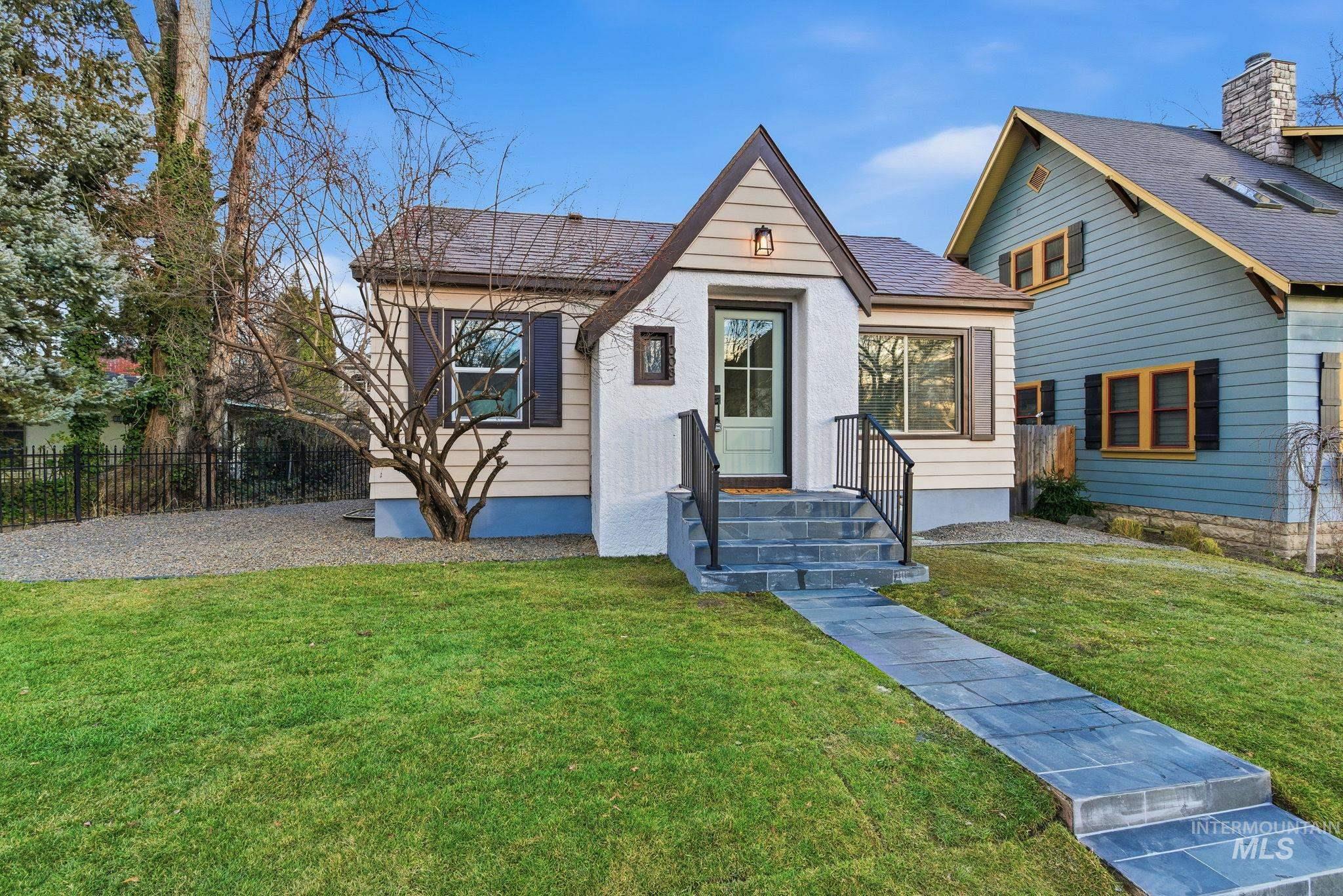 View of front of home with roof with shingles