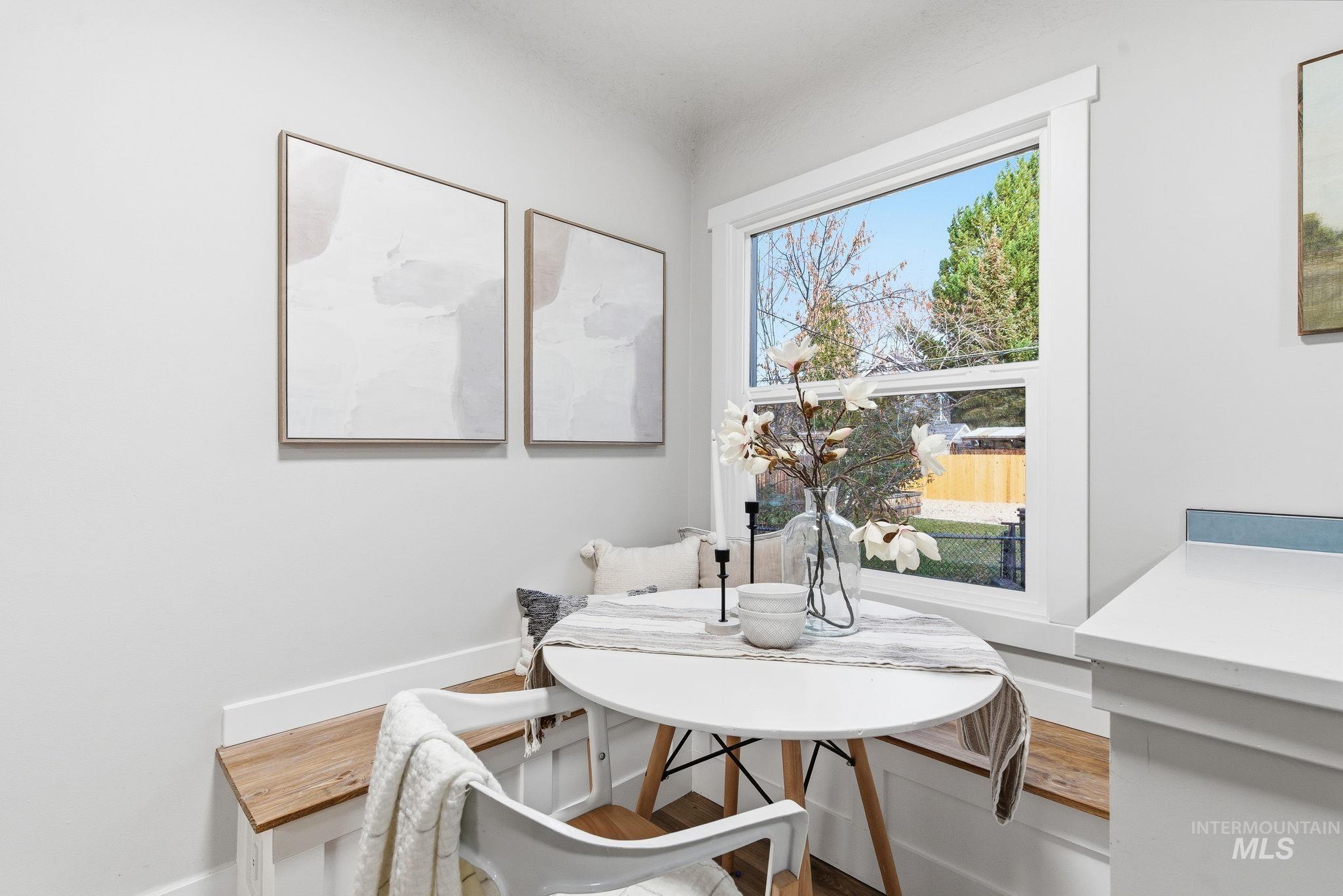 Dining area featuring wood finished floors and baseboards