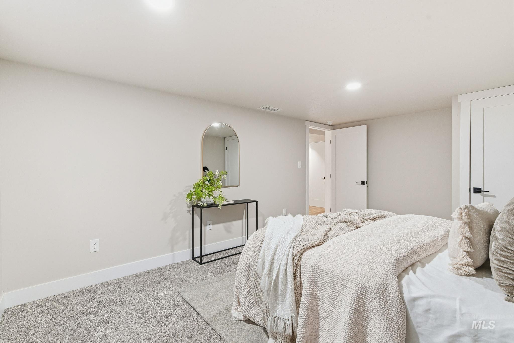 Bedroom with carpet and recessed lighting