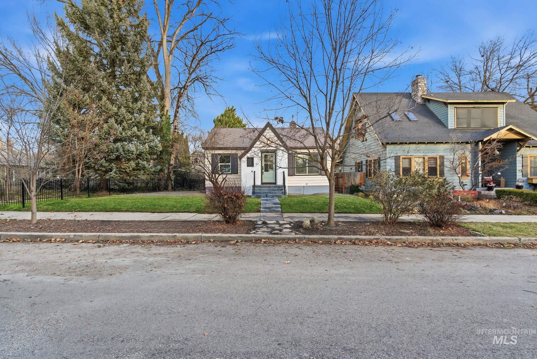 View of front of house featuring a chimney