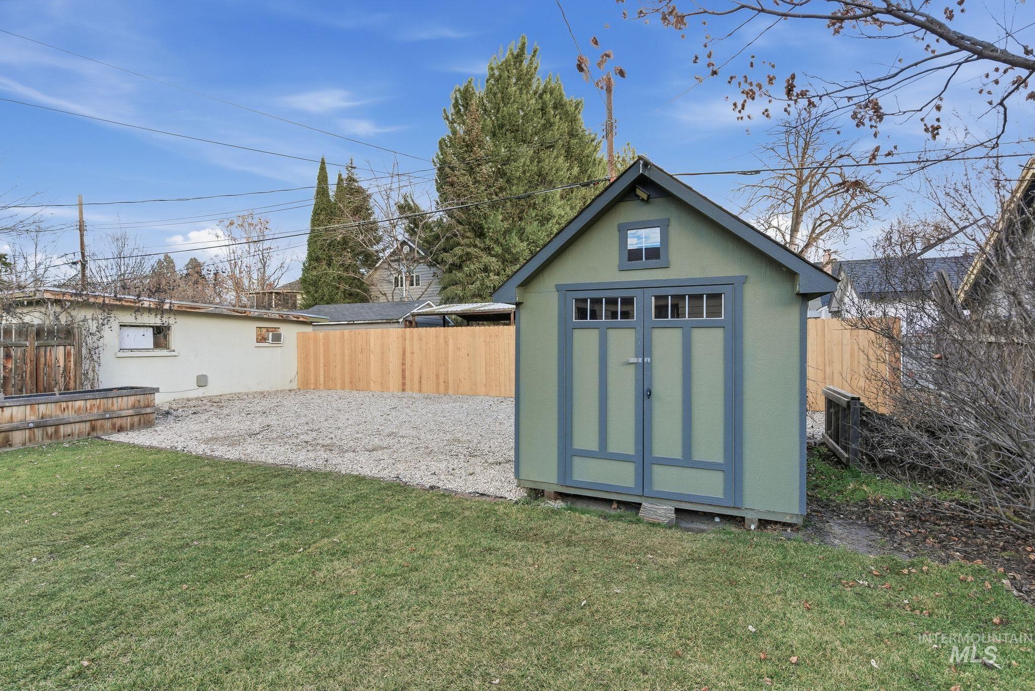 View of shed featuring a fenced backyard