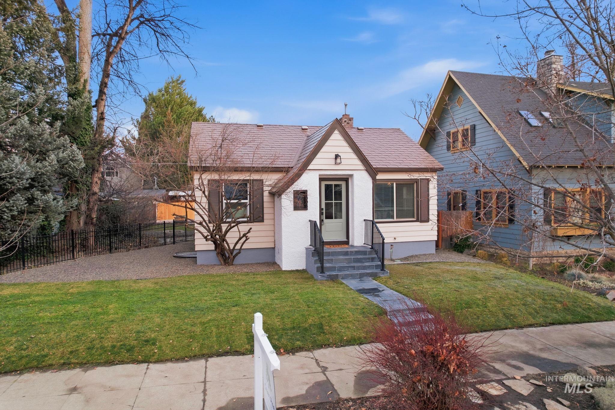 View of front of house with a chimney