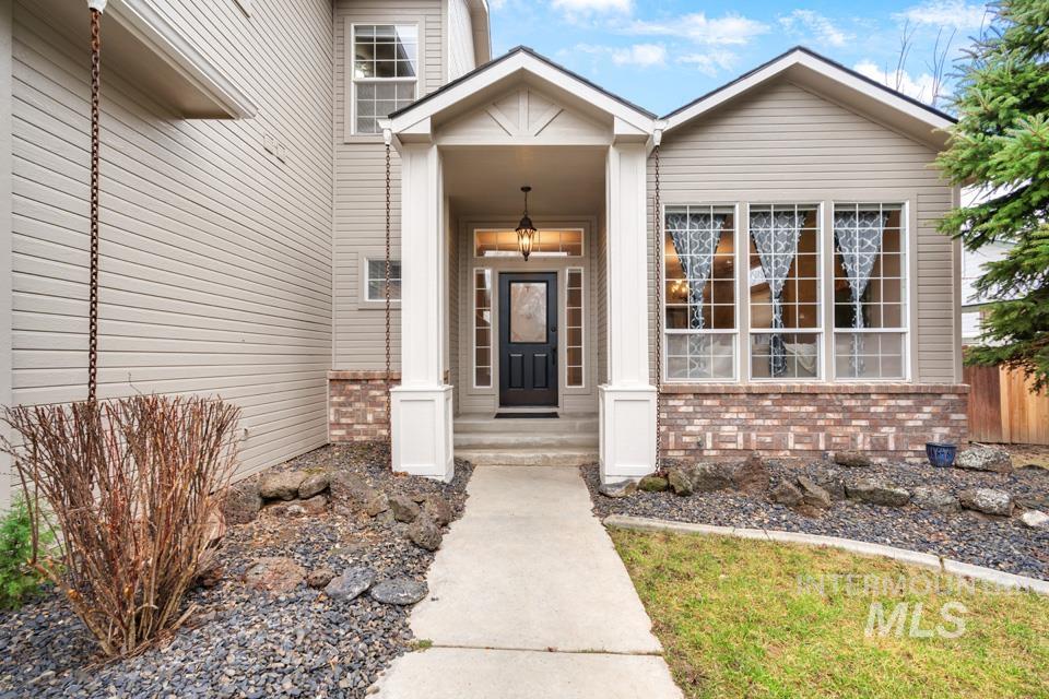 Entrance to property with brick siding
