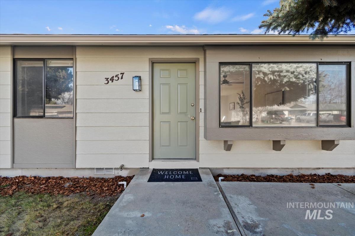 View of exterior entry featuring crawl space