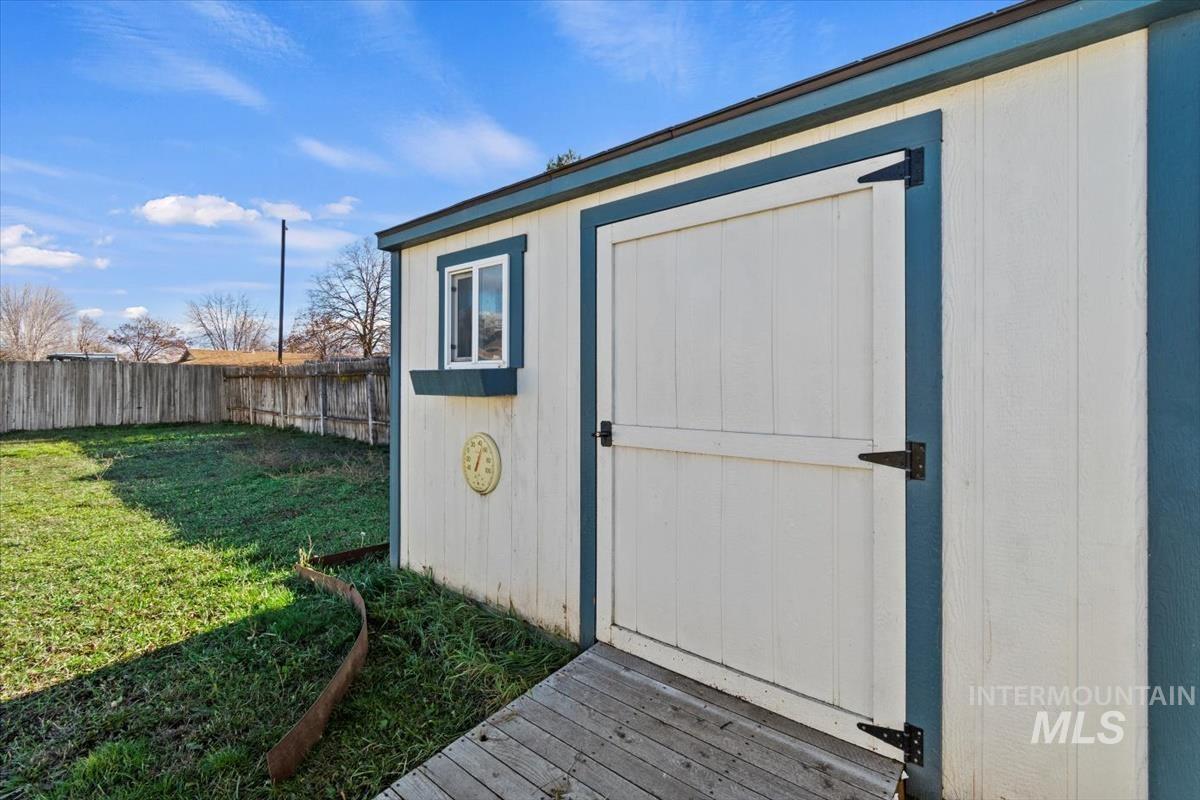 View of shed featuring a fenced backyard
