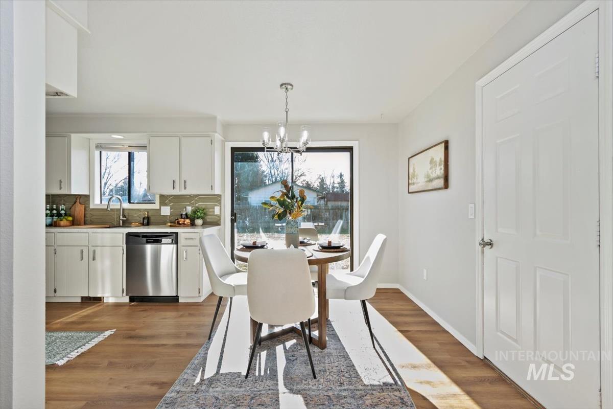 Dining room featuring a chandelier and light wood finished floors