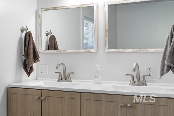Bathroom featuring double vanity