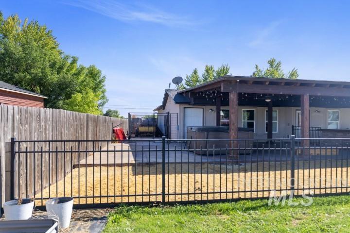 View of pool featuring a patio area and a fenced backyard