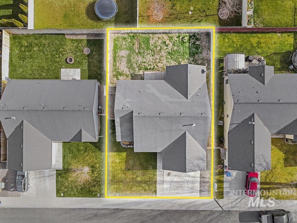 Aerial perspective of suburban area featuring property parcel outlined
