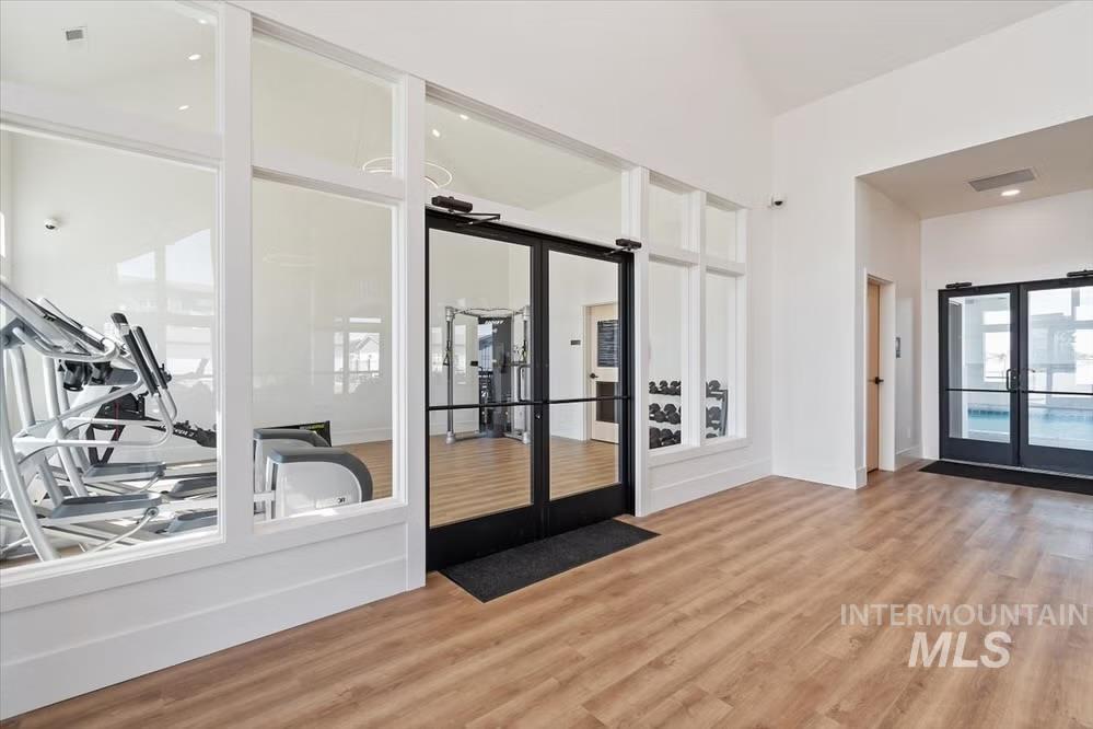 Spare room featuring french doors and light wood finished floors