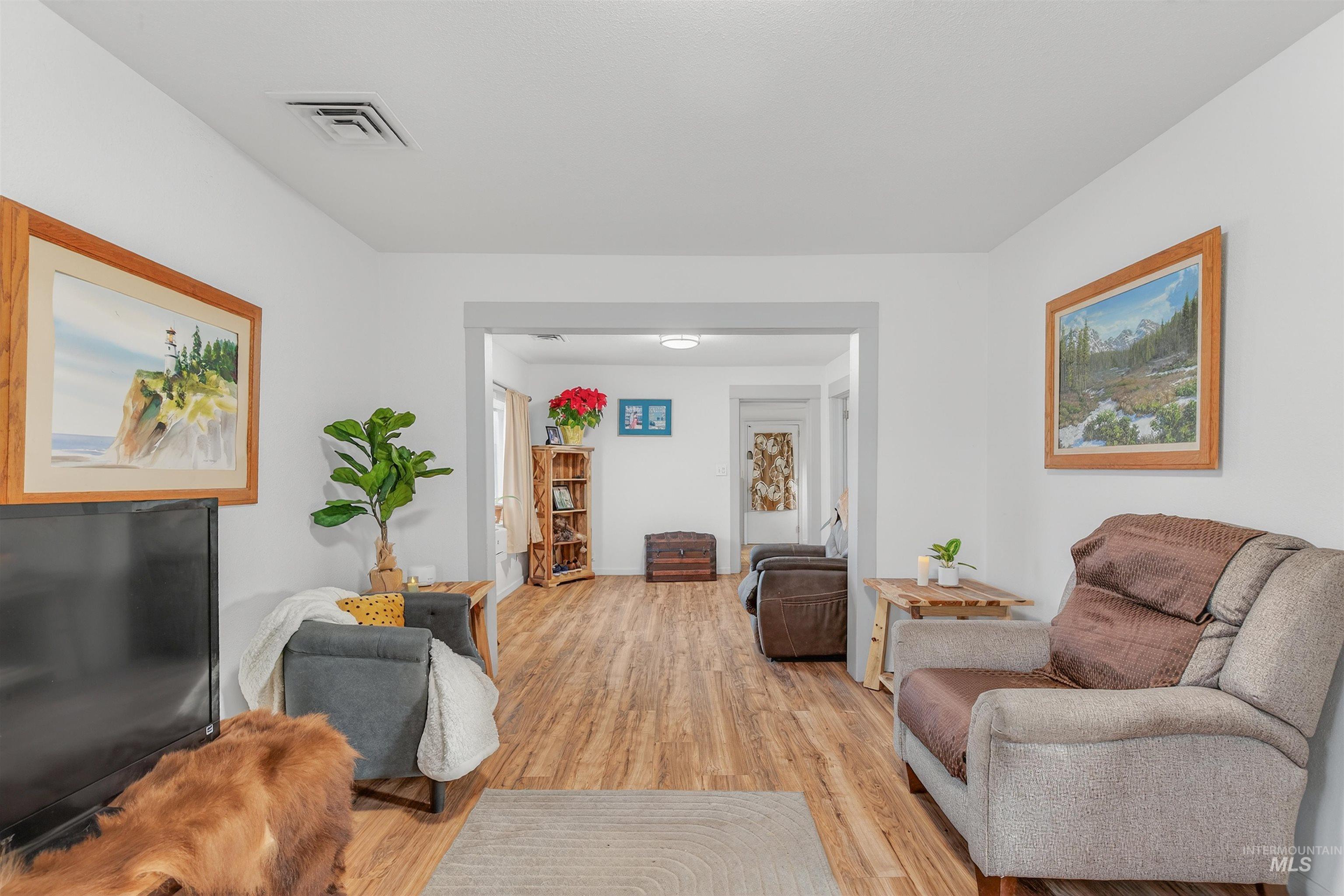 Living room featuring light wood-style floors