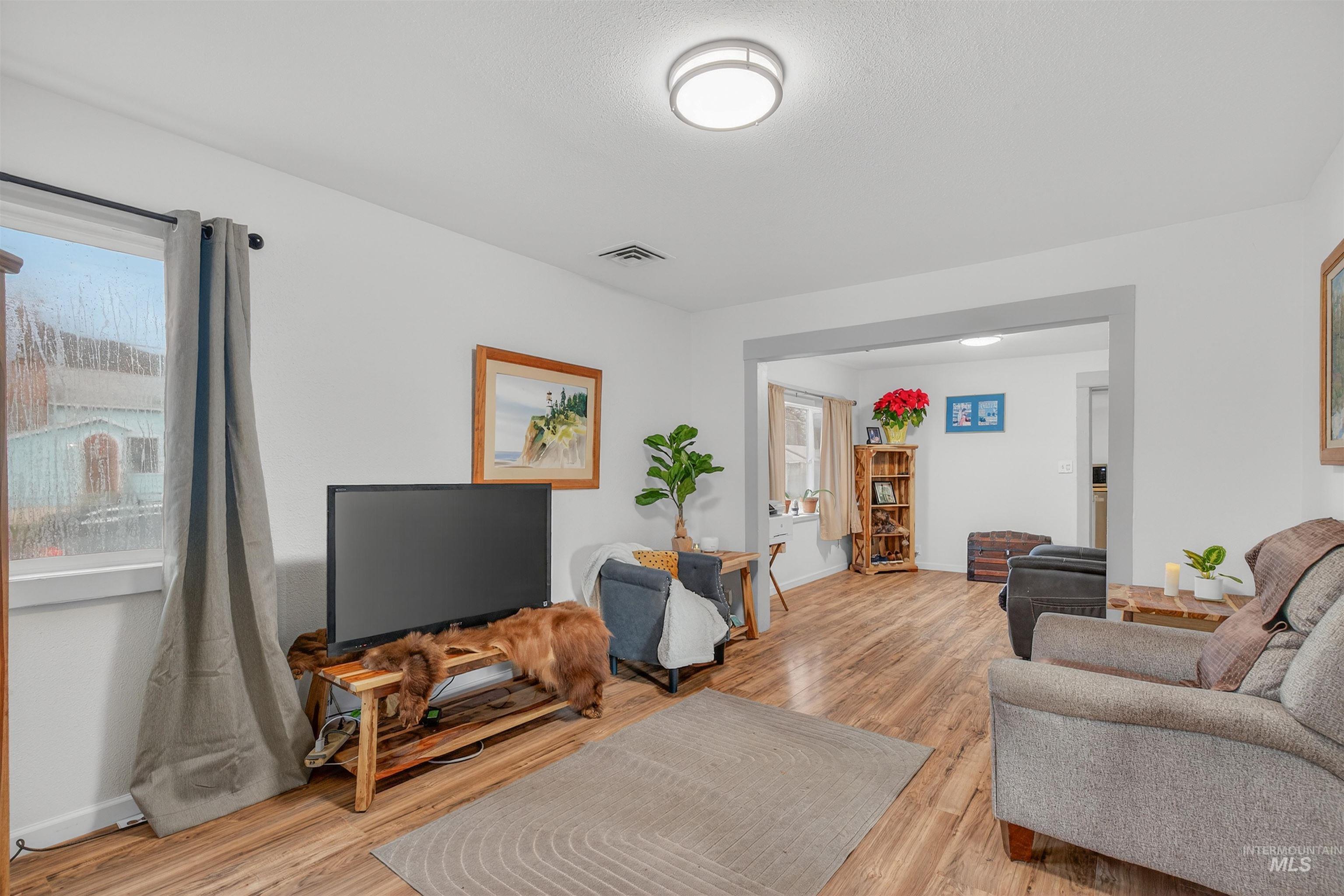Living area with light wood-style floors