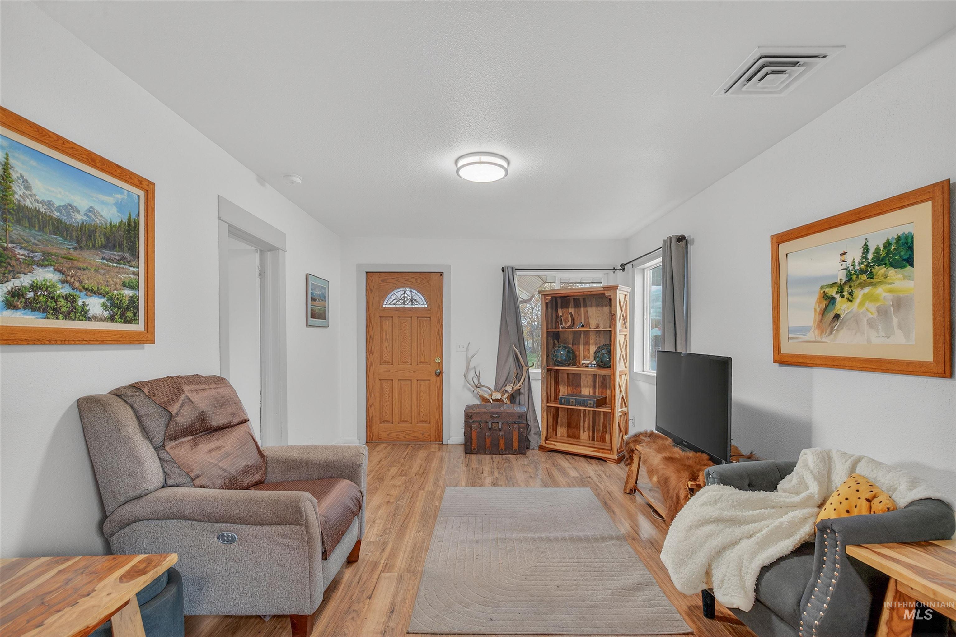 Living room featuring wood finished floors