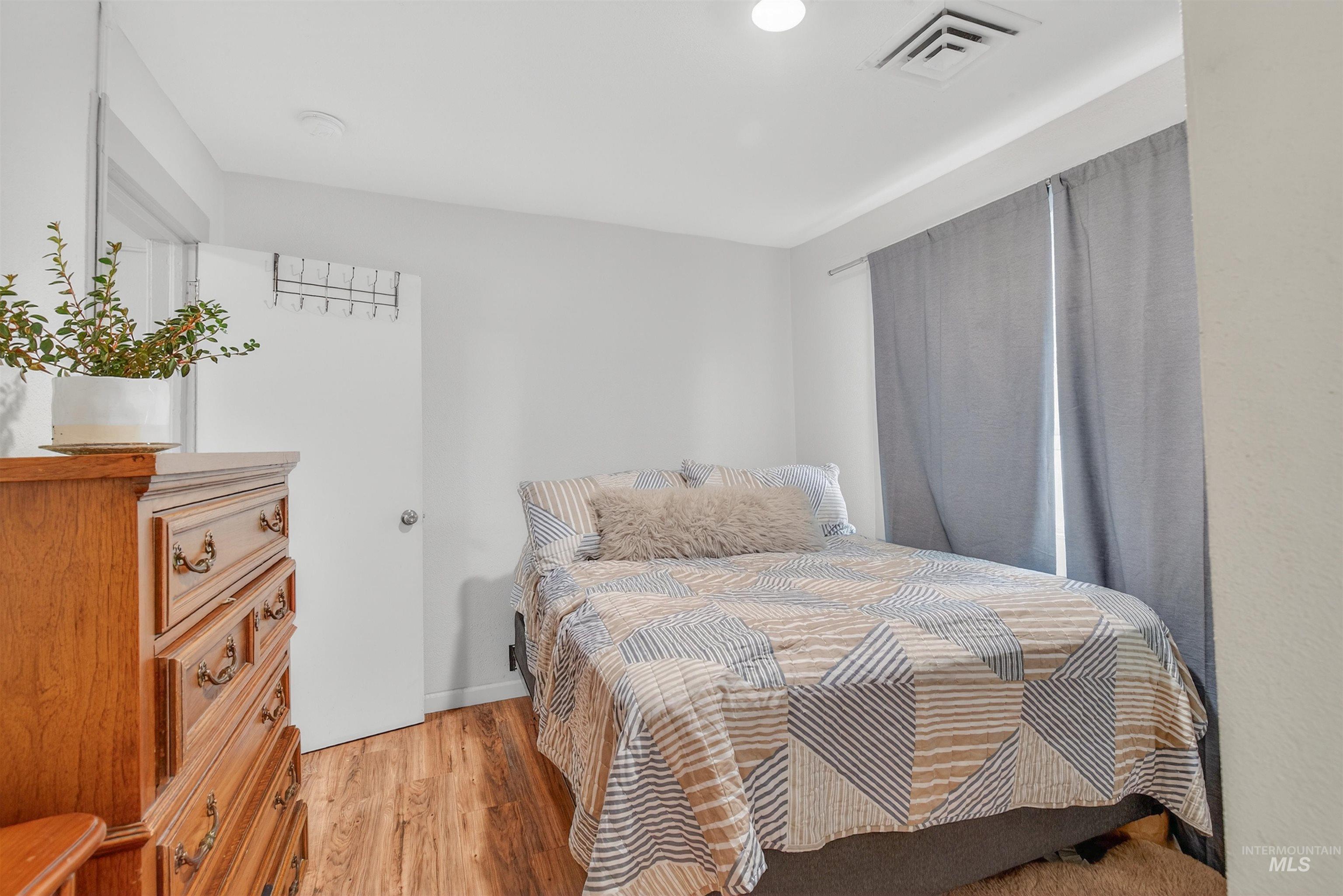 Bedroom featuring light wood-type flooring