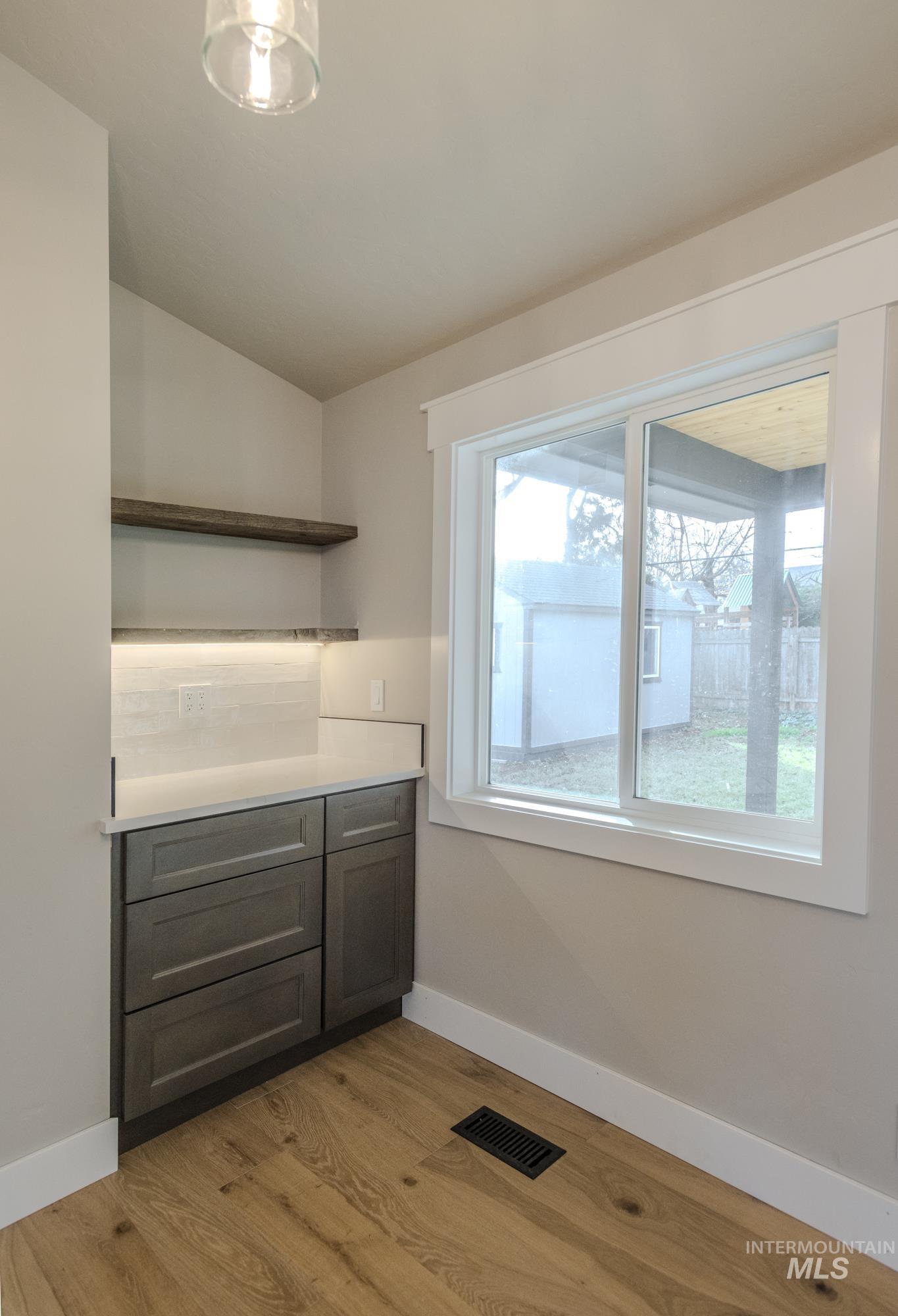 Barn wood floating shelves in coffee nook.