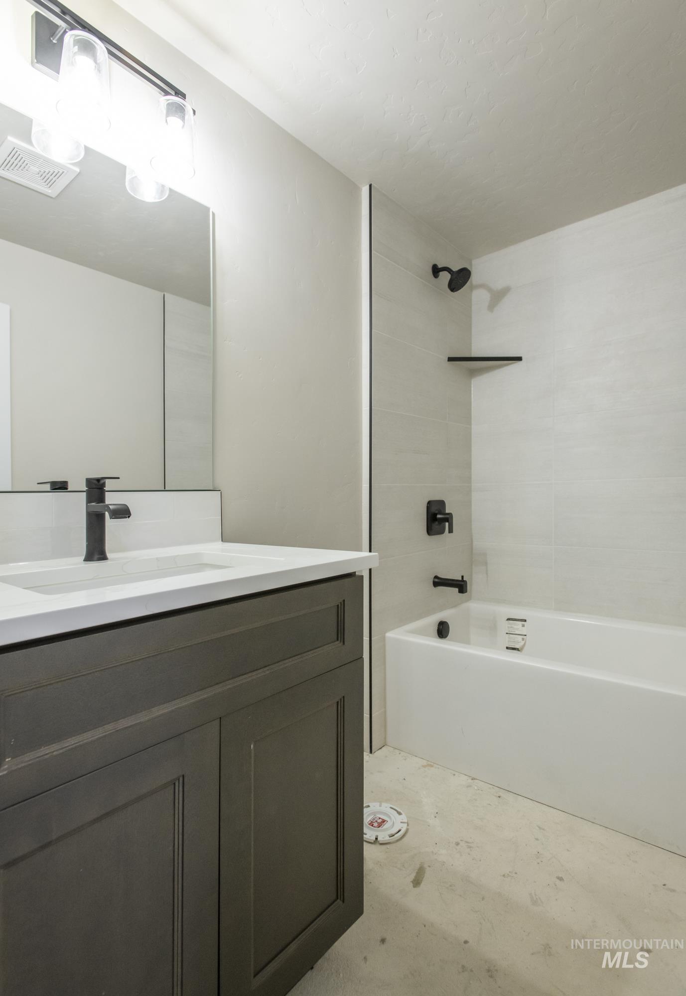 Full bathroom featuring shower / washtub combination and vanity