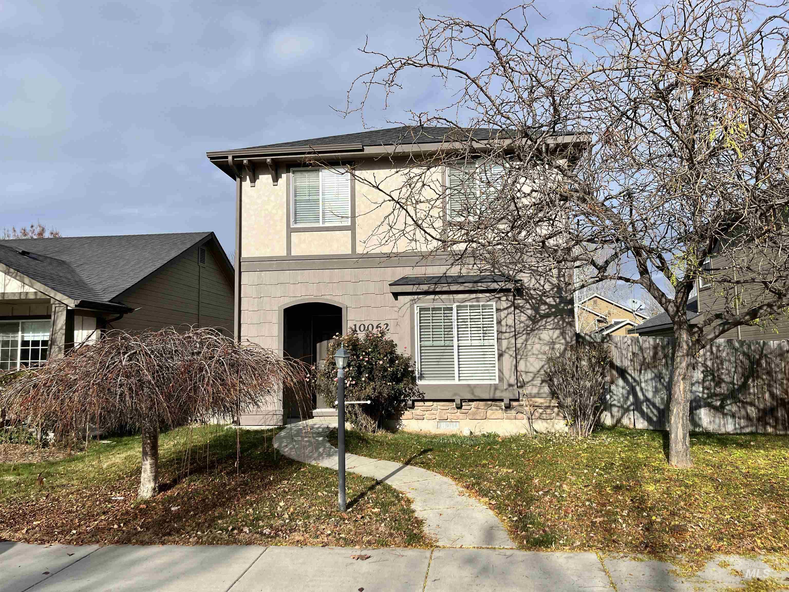 View of front of property featuring stucco siding