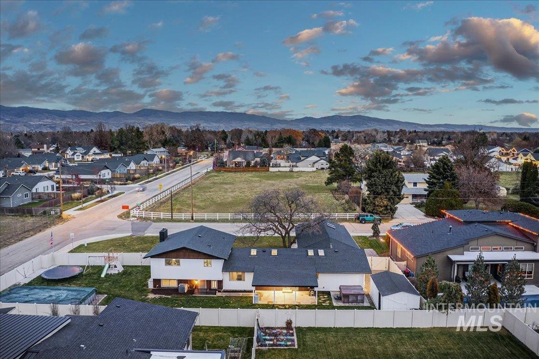 Aerial view at dusk of a residential view and a mountain view