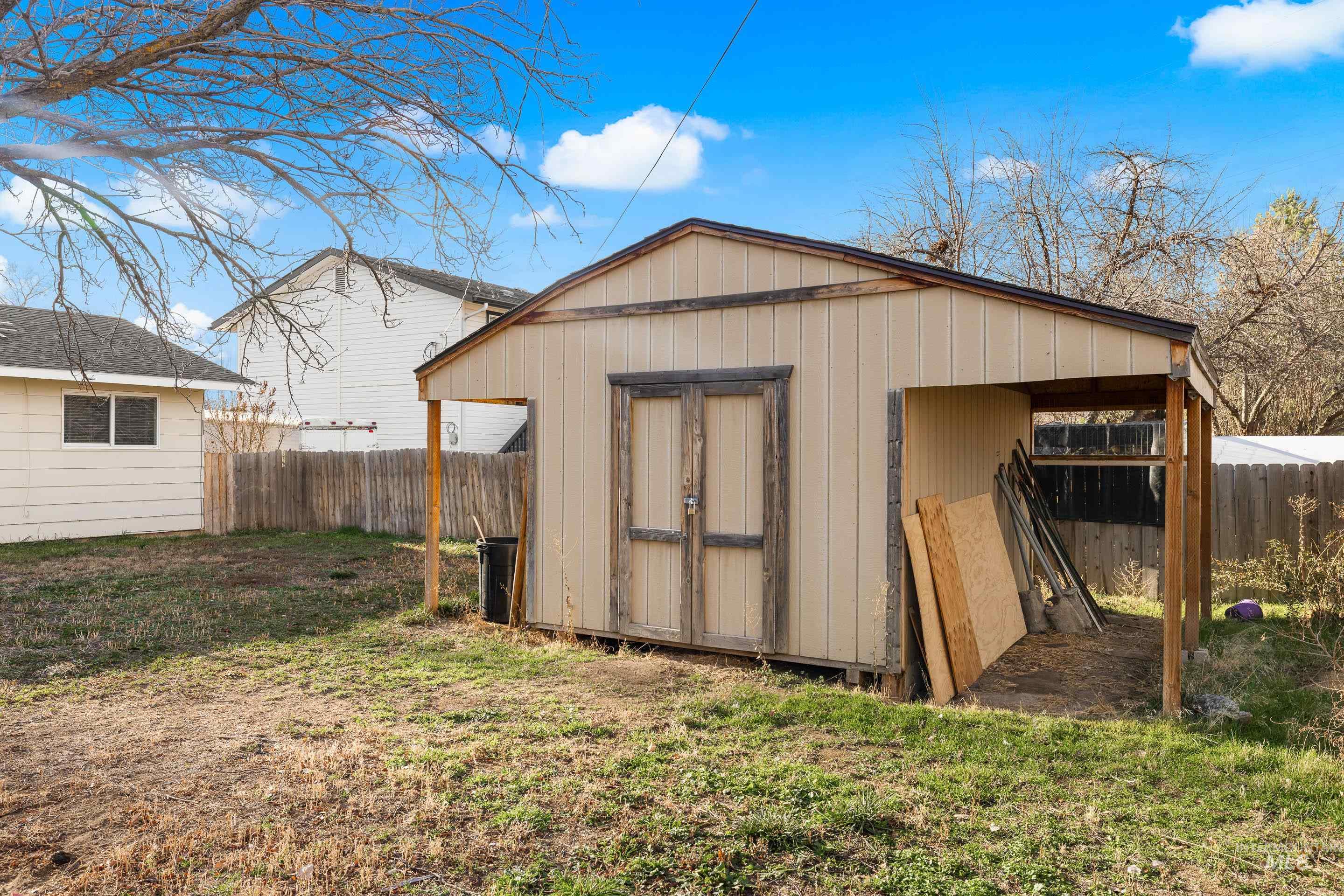 View of shed featuring a fenced backyard