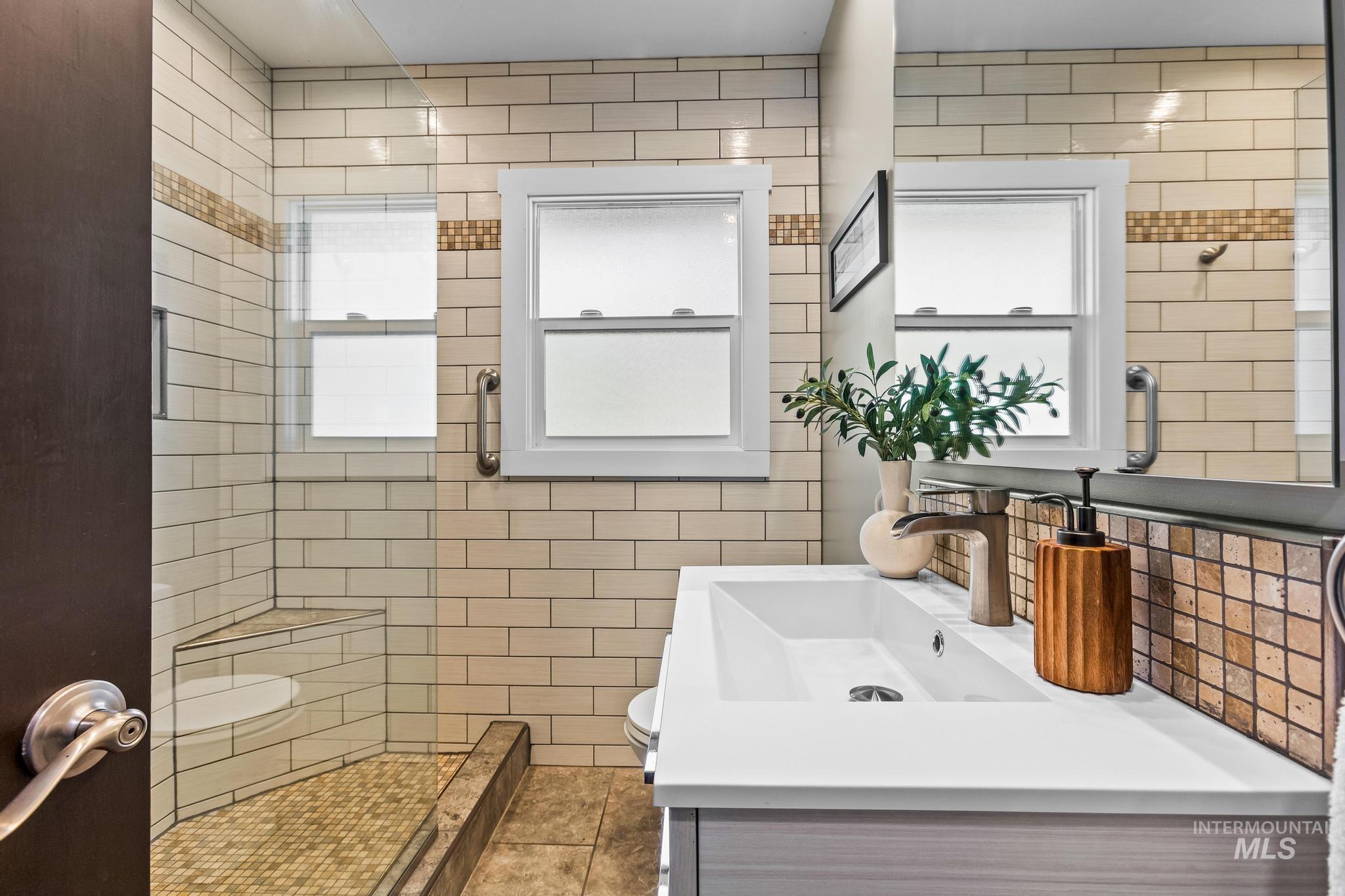 Bathroom featuring vanity and toilet